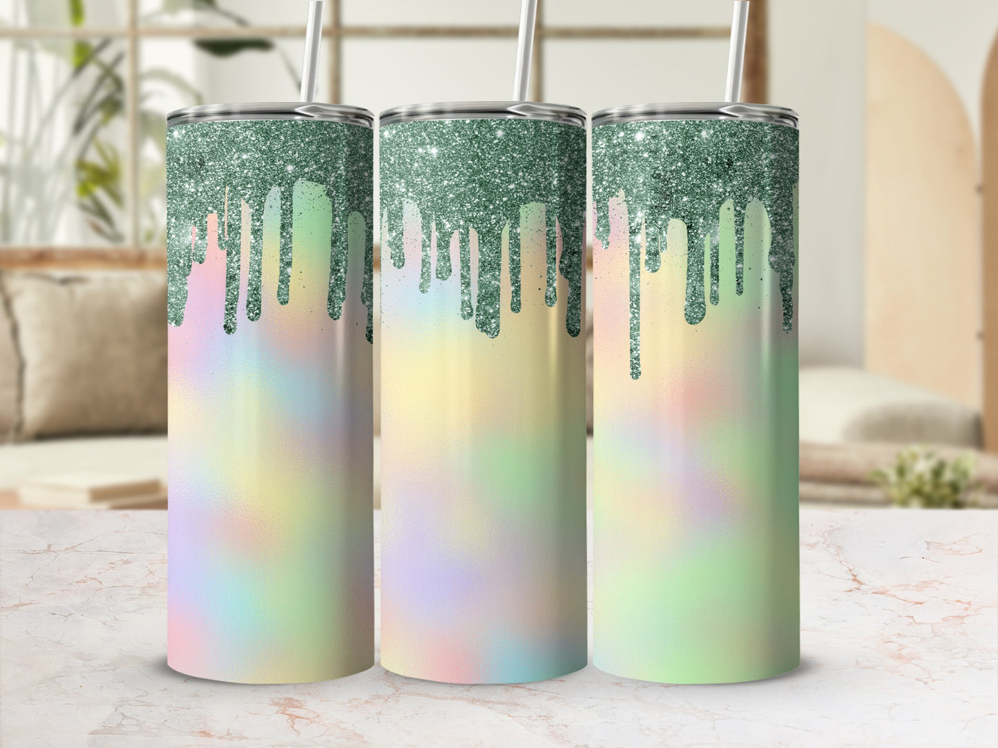 Three glitter-dripped tumblers with pastel tie-dye patterns.