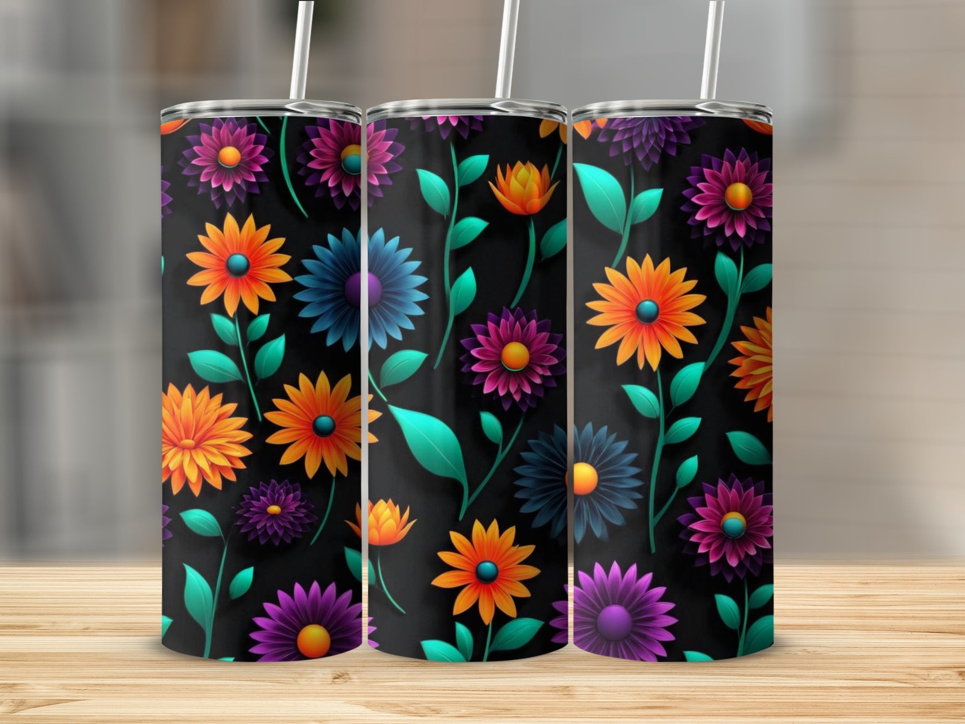 Three tumblers with a colorful floral pattern on a black background.