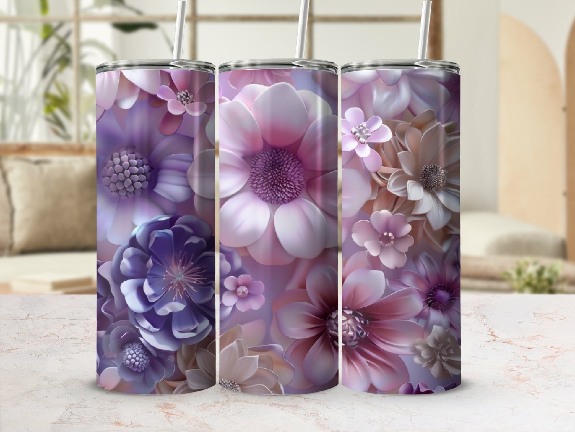 Three tumblers with floral designs in shades of purple and pink.
