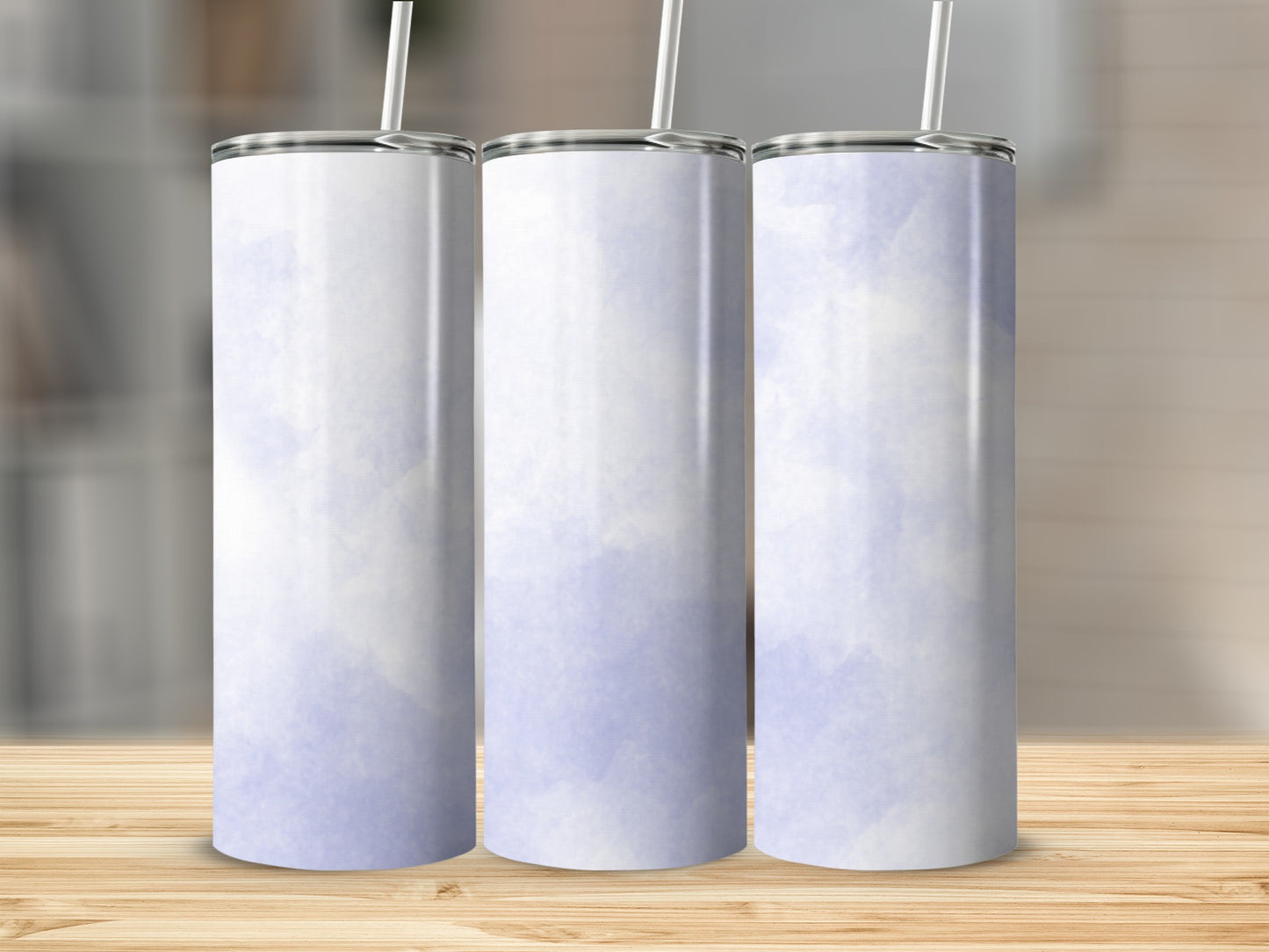 Three white tumblers with light blue watercolor design and straws.