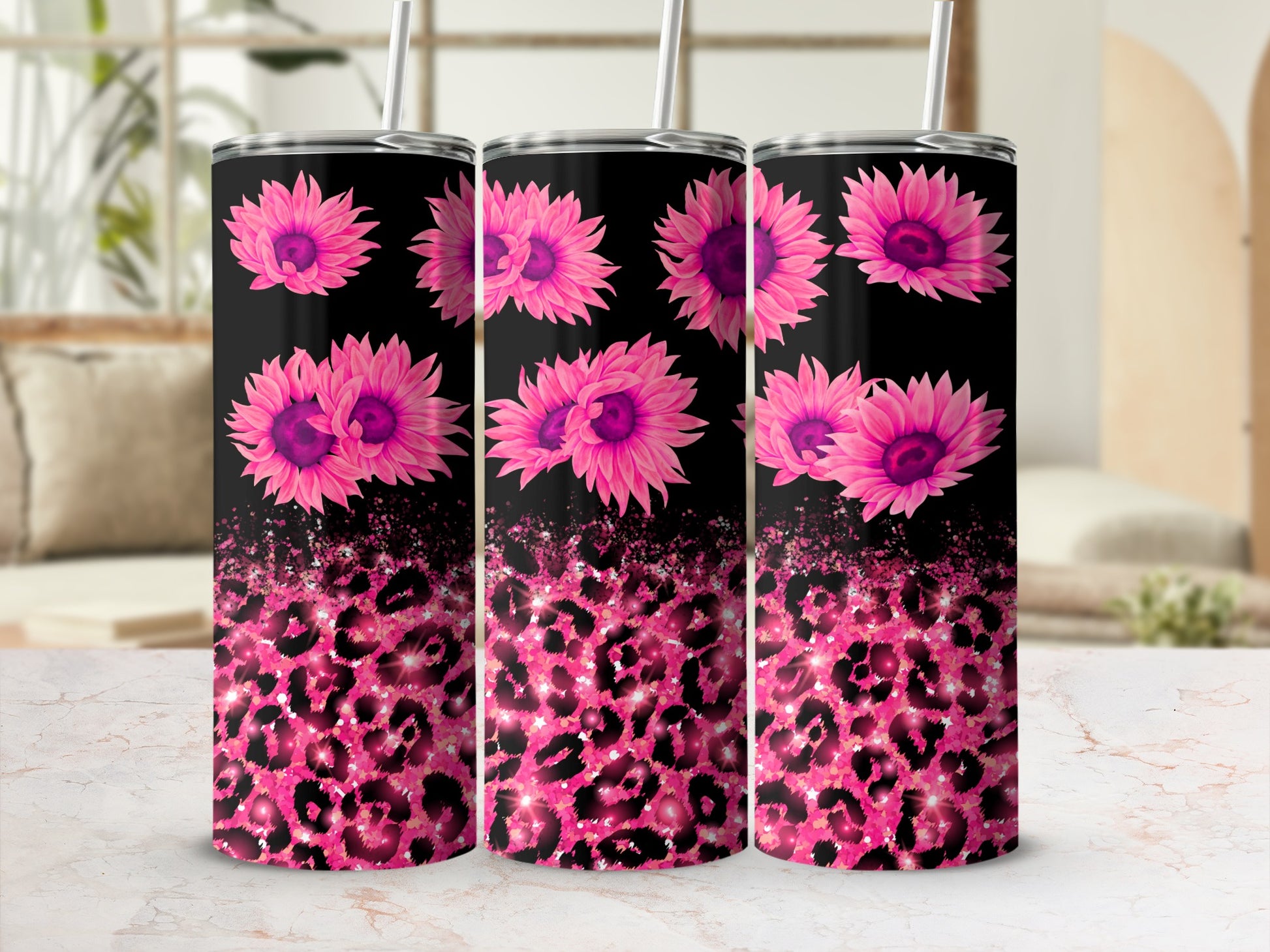 Black tumbler with pink flowers and pink leopard print.