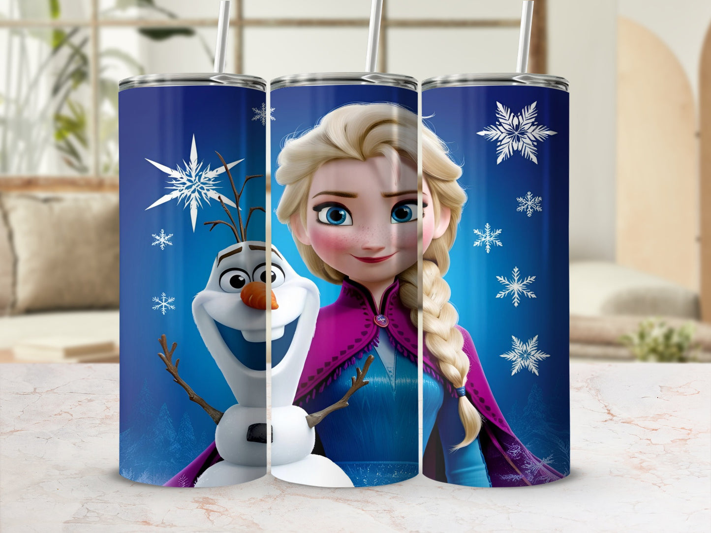 Olaf and Elsa from Frozen on a blue tumbler with snowflakes.