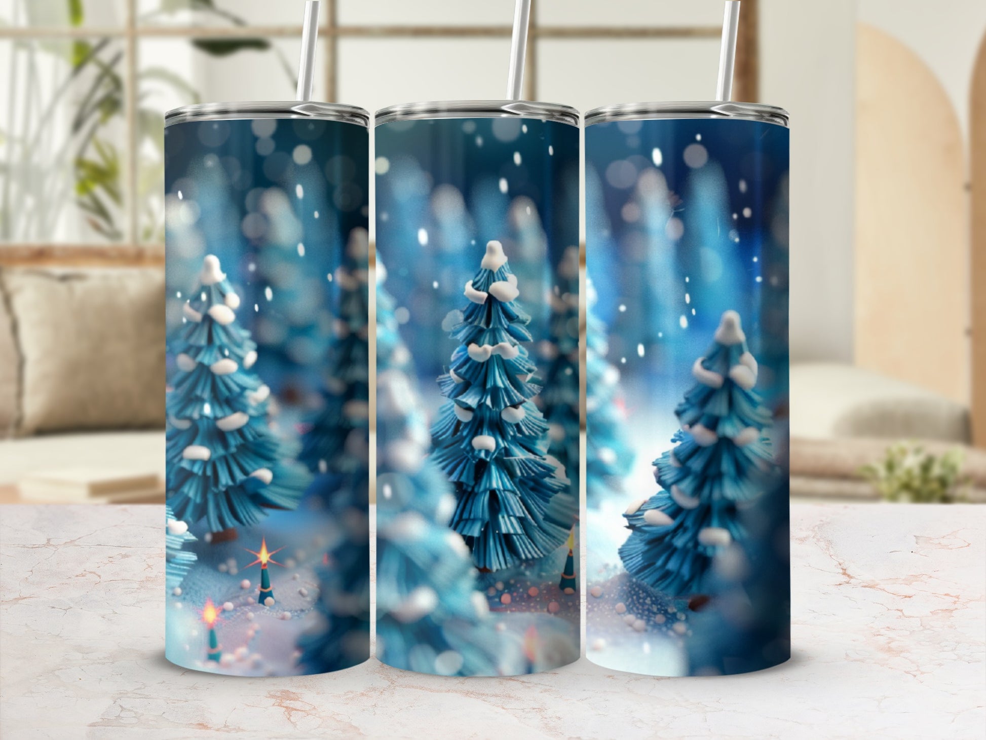 Three tumblers with a snowy forest and Christmas tree design.