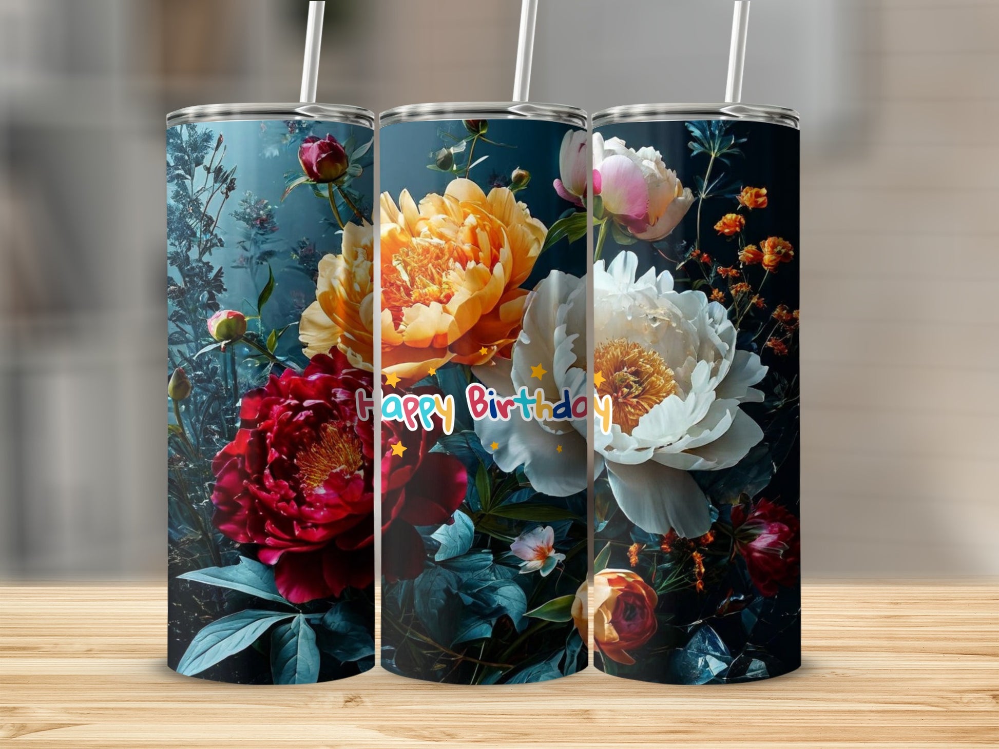 Three tumblers featuring colorful floral designs and "Happy Birthday" text.