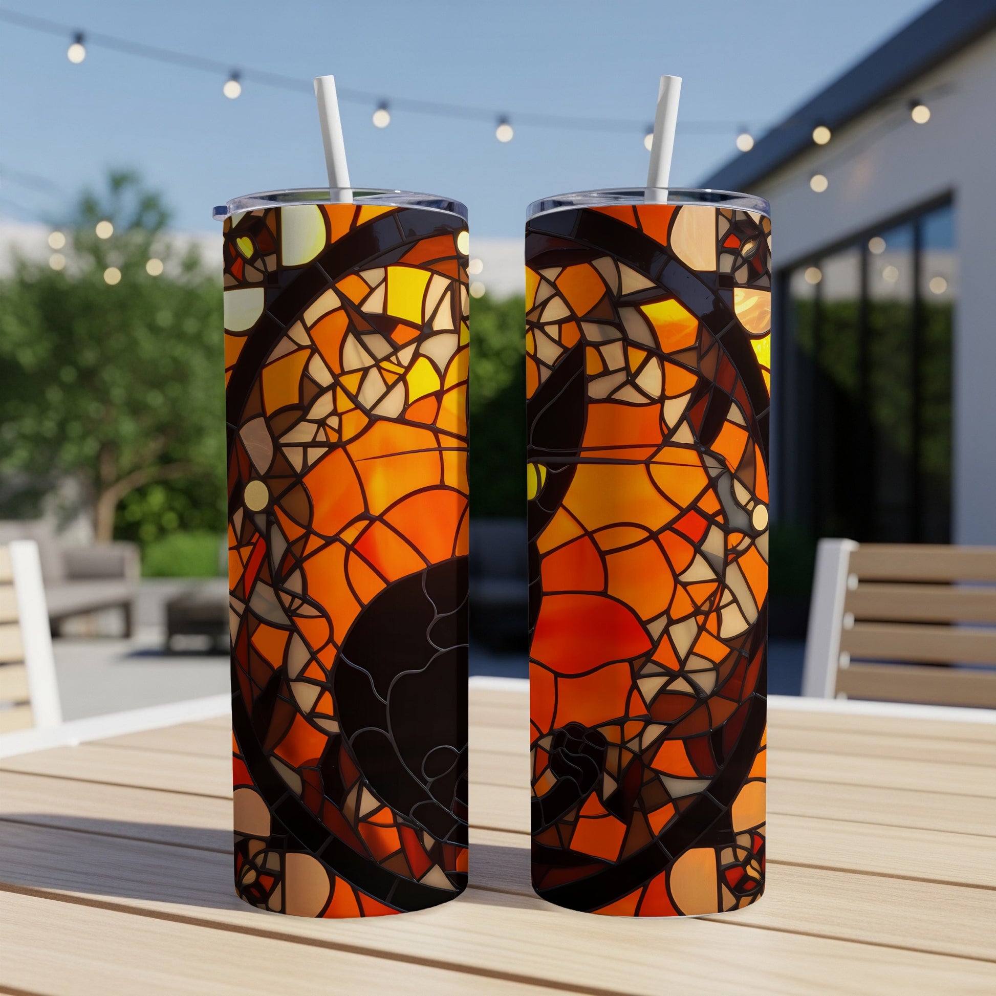 Two tumblers with a stained glass-style black cat and orange pattern.