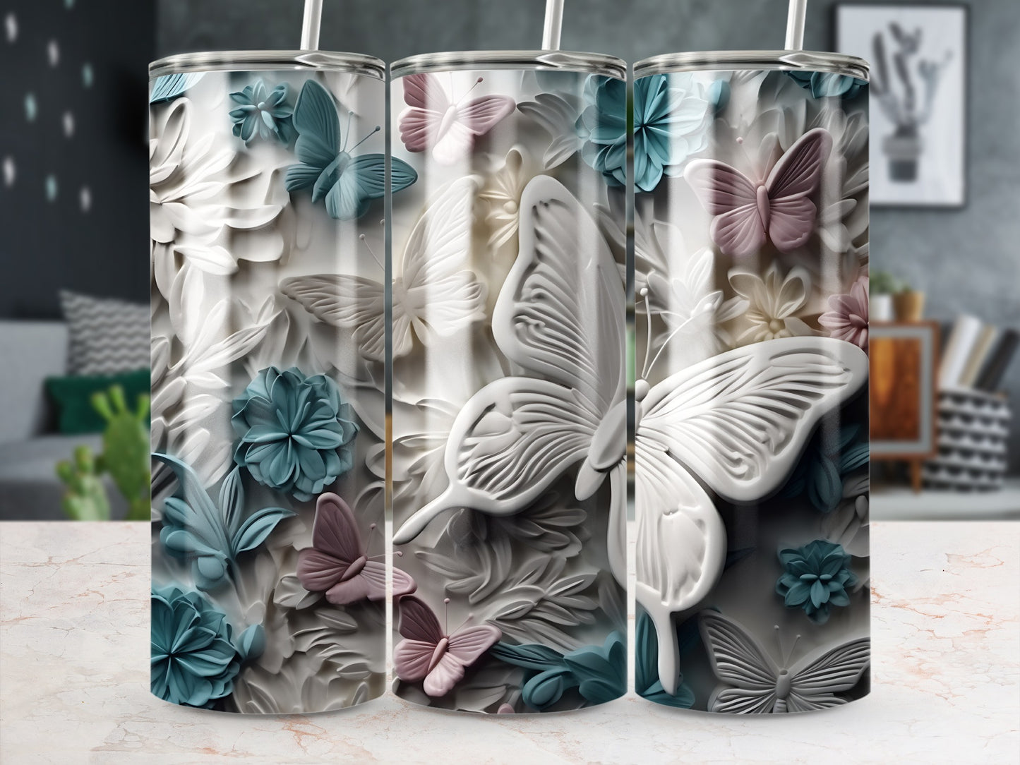 White butterfly and floral pattern on a tumbler with two straws.
