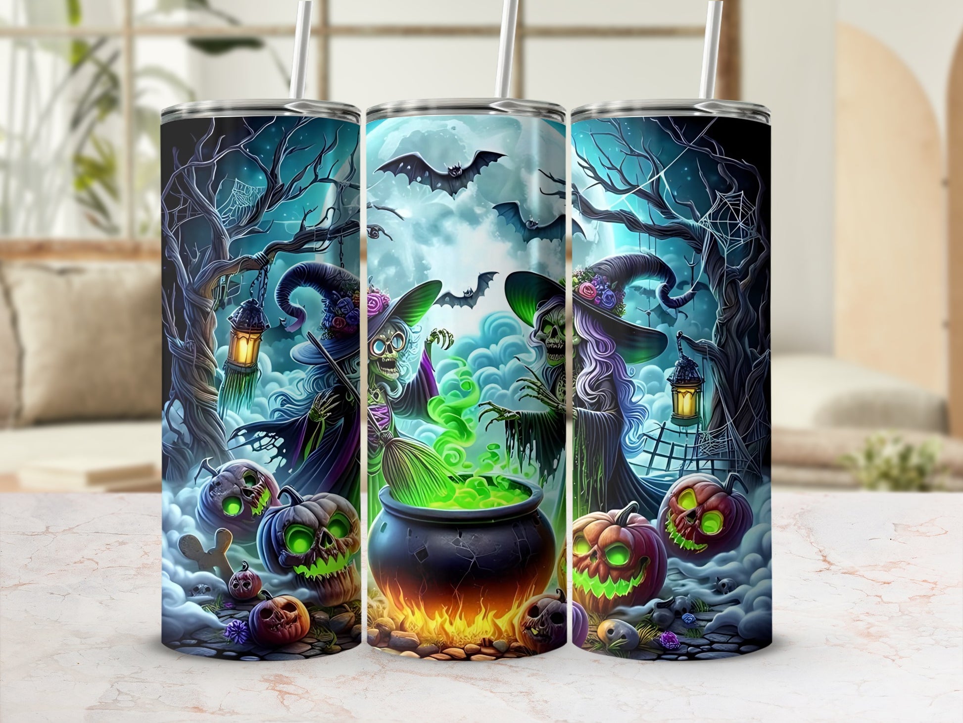 Three tumblers with Halloween witches, cauldrons, pumpkins, and bats.