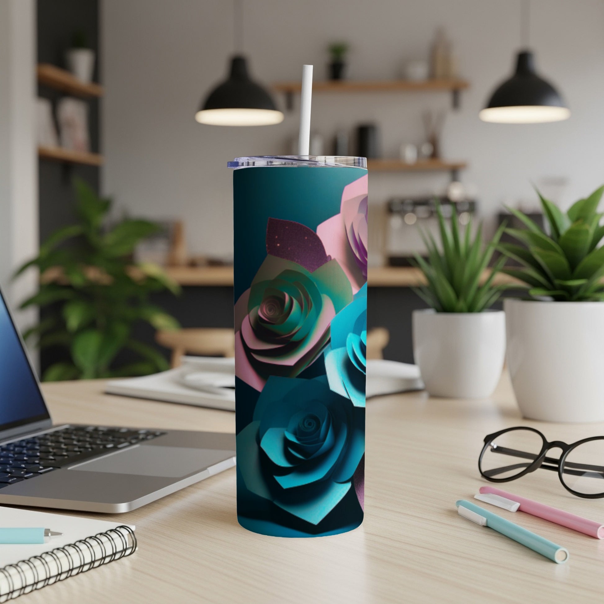 Tall tumbler with teal and pink paper roses against a dark background.