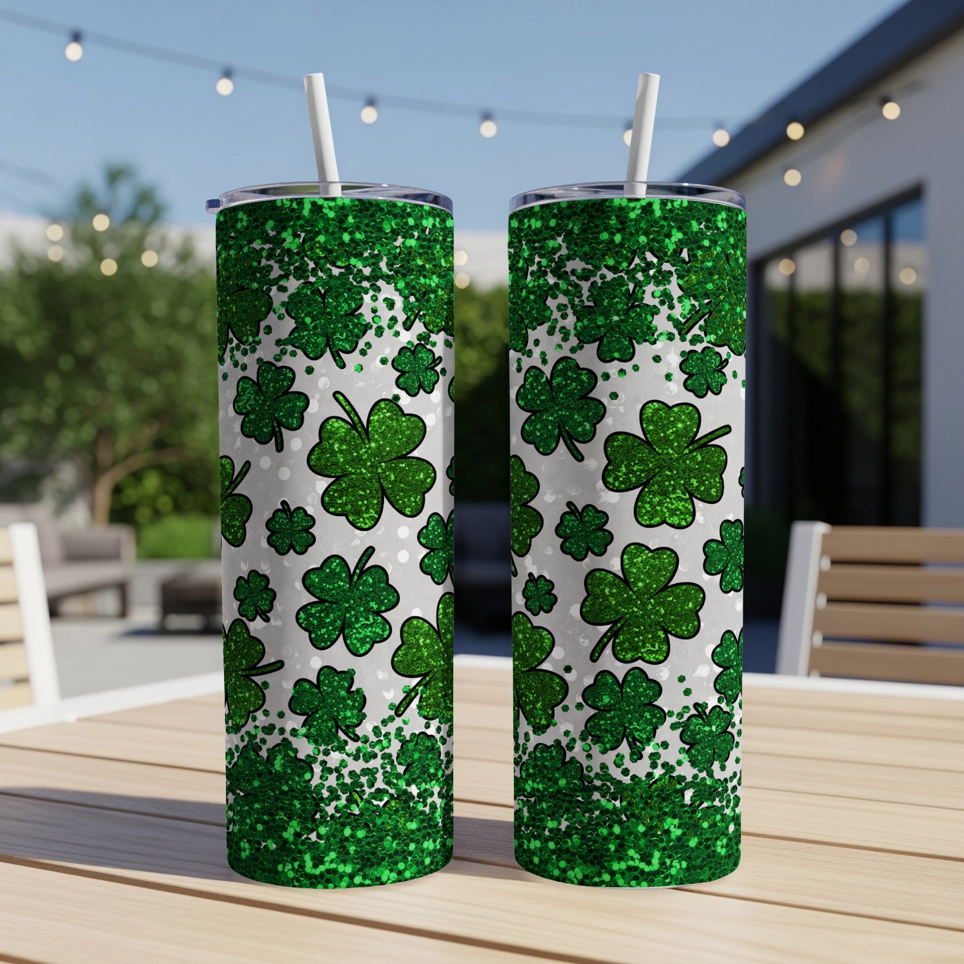 Two tall tumblers with green shamrock and glitter pattern.
