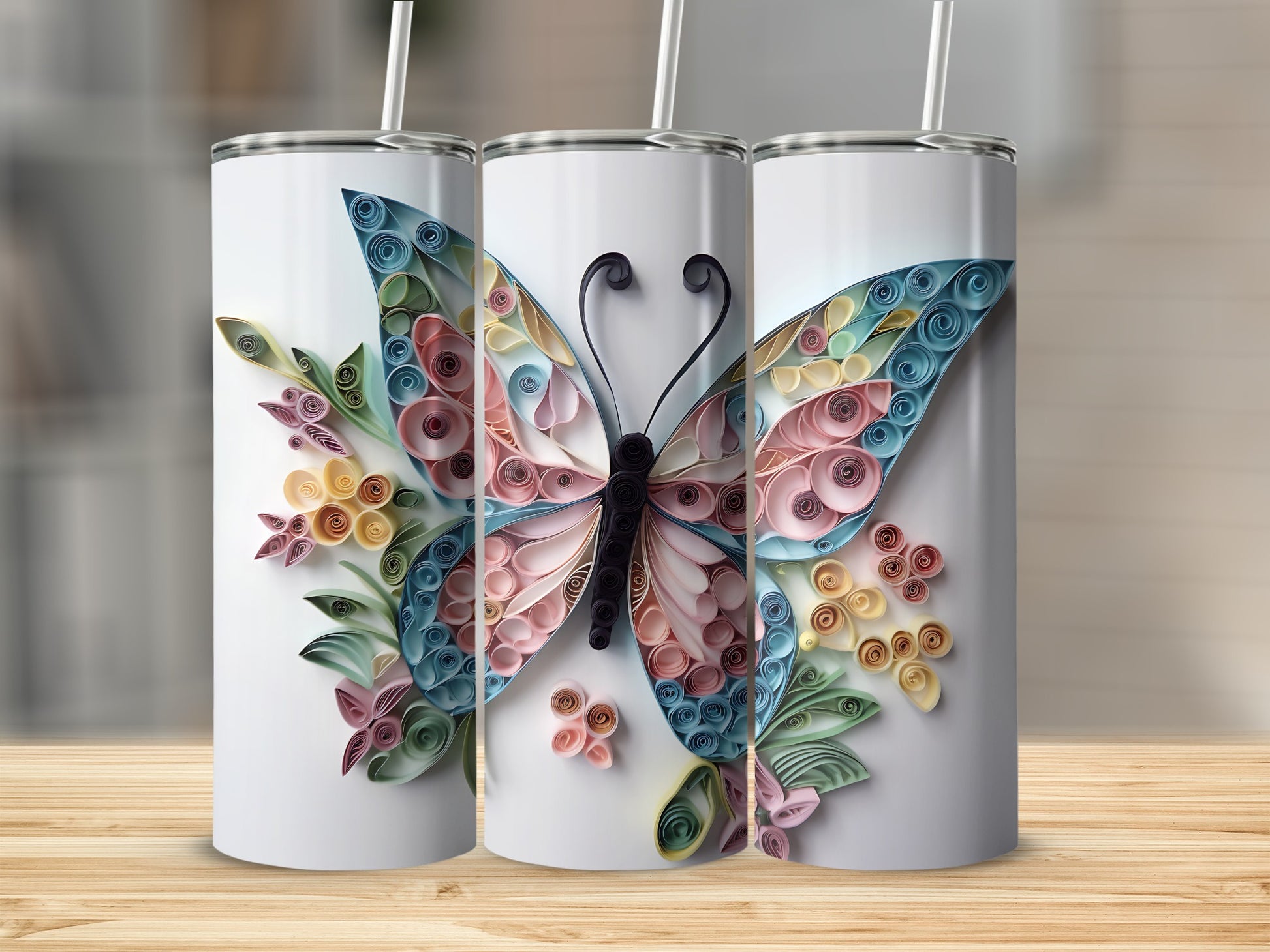 Three tumblers featuring a colorful quilled paper butterfly design.