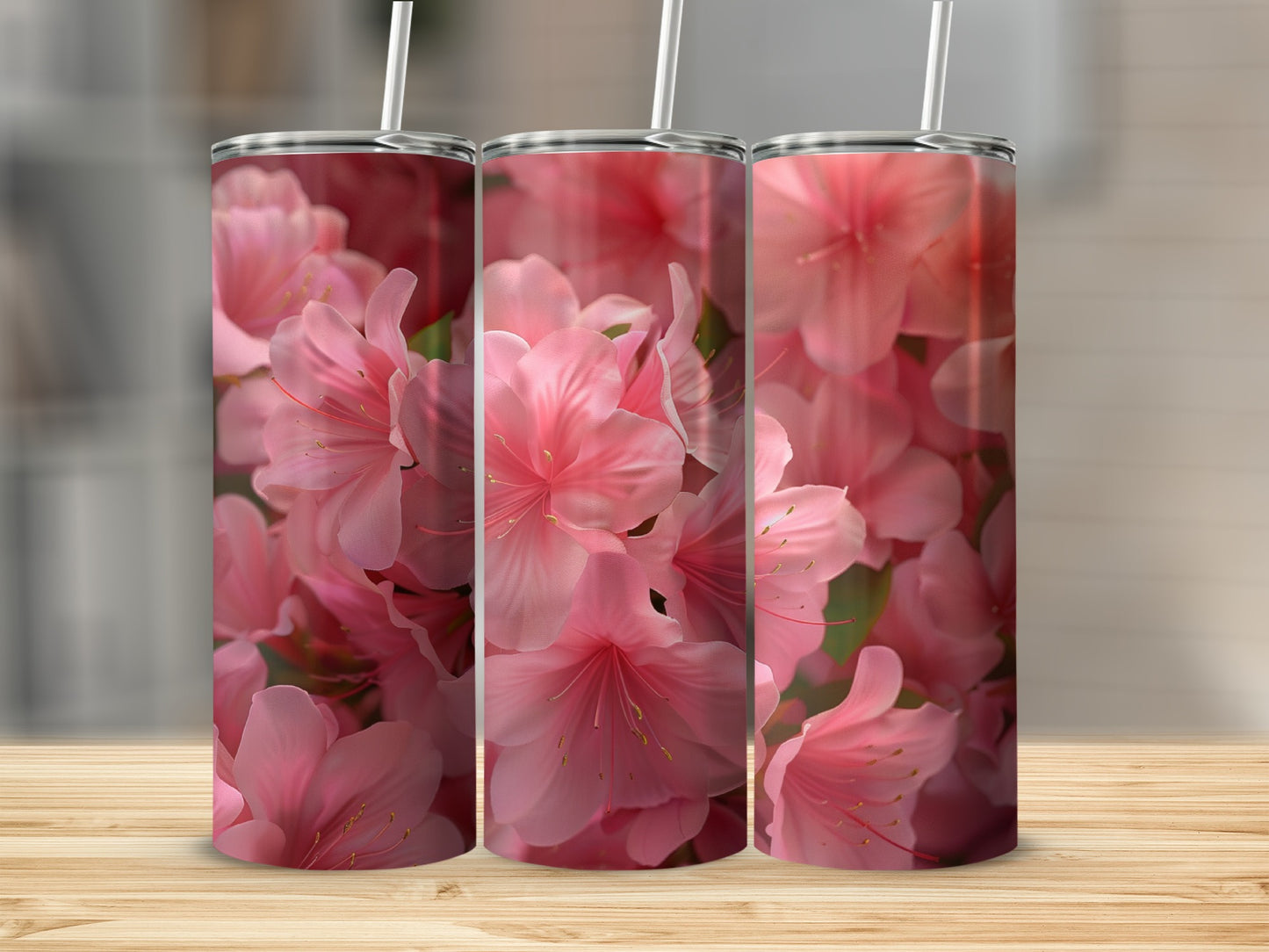 Three tumblers with a close-up floral pattern of pink azaleas.