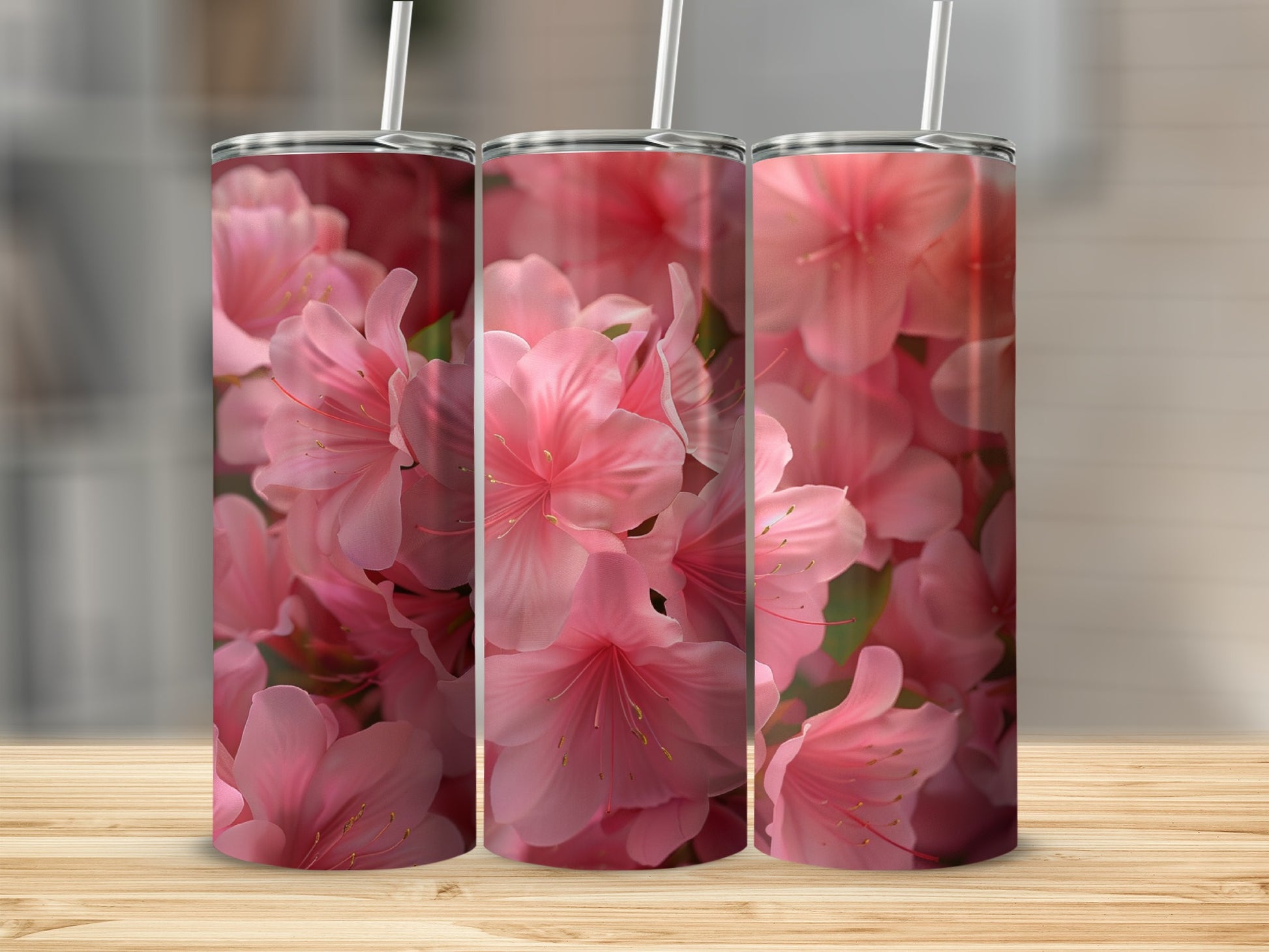 Three tumblers with a close-up floral pattern of pink azaleas.