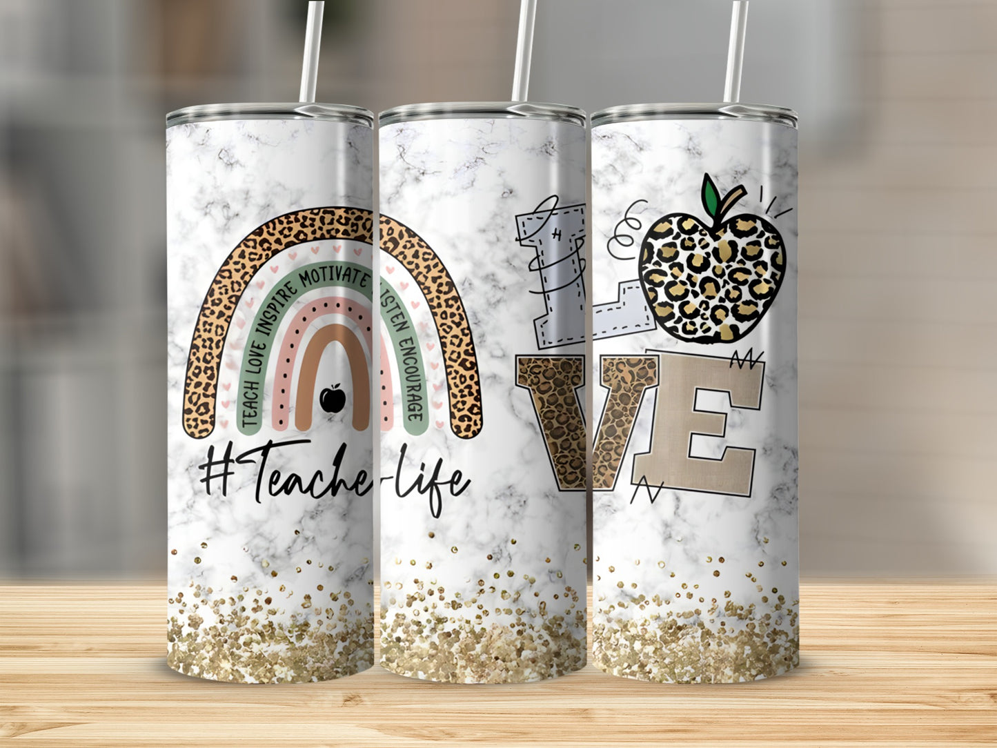 Marble tumbler with rainbow, apple, and "love" text, sprinkled with glitter.