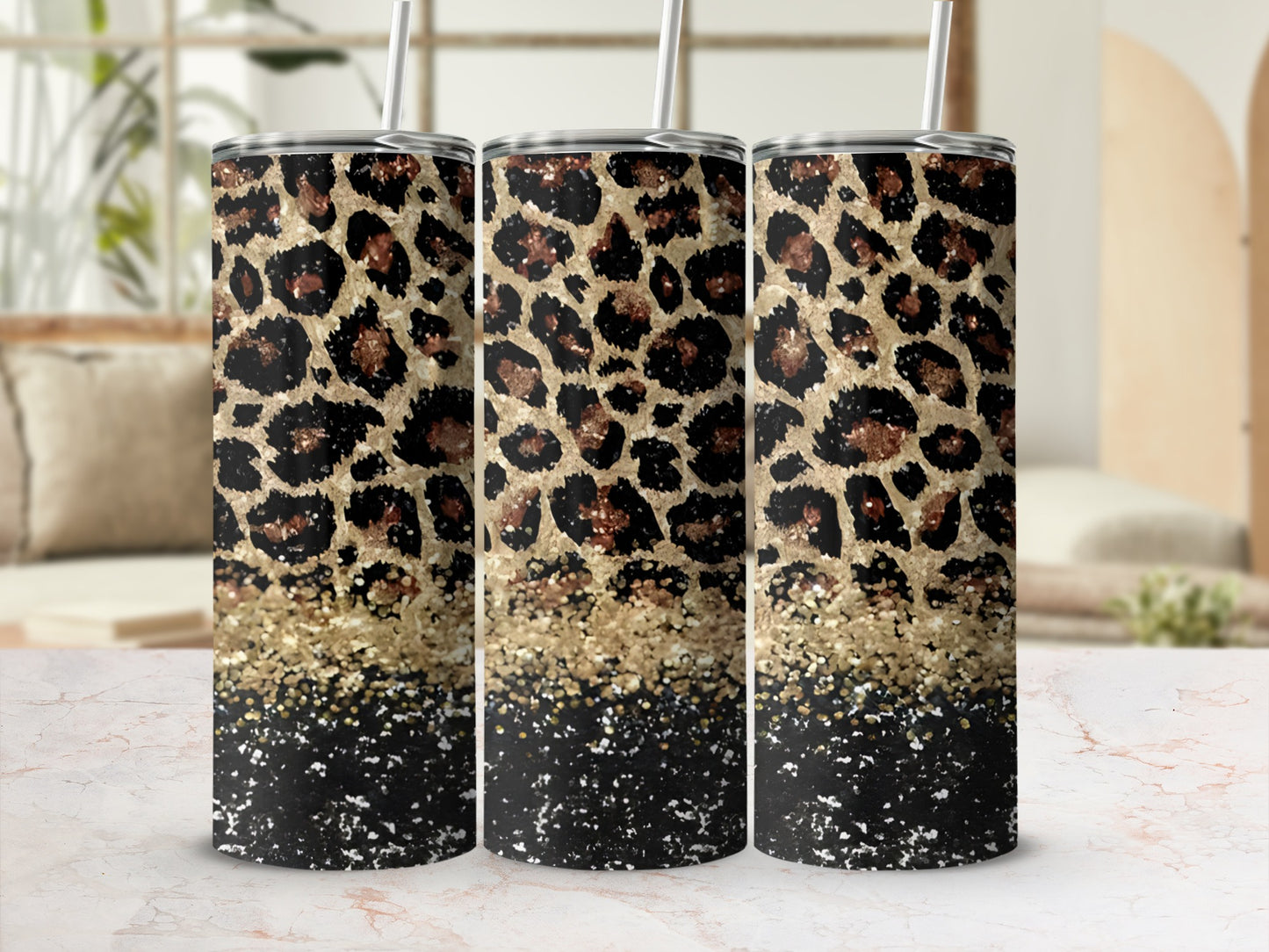 Three tumblers with leopard print and gold glitter design.