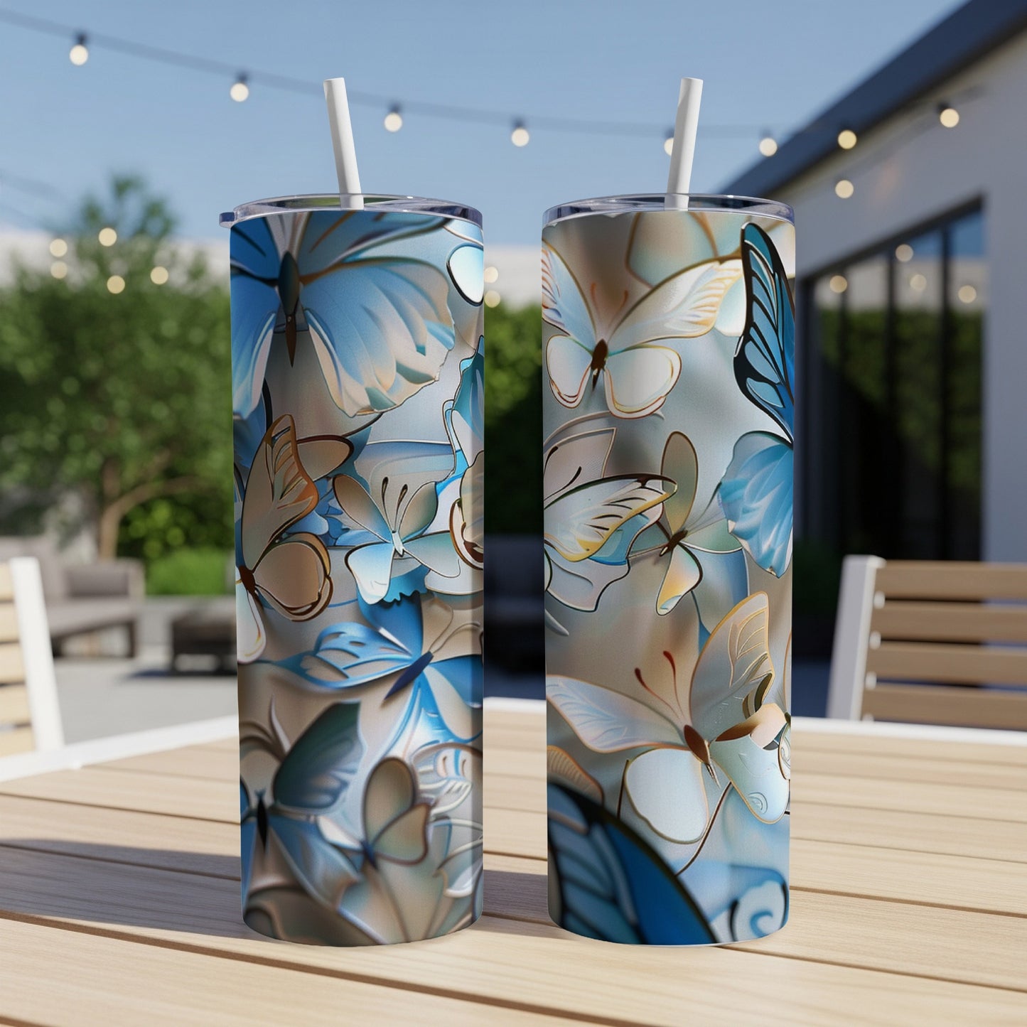 Two tall, slender tumblers with a blue and white butterfly pattern.