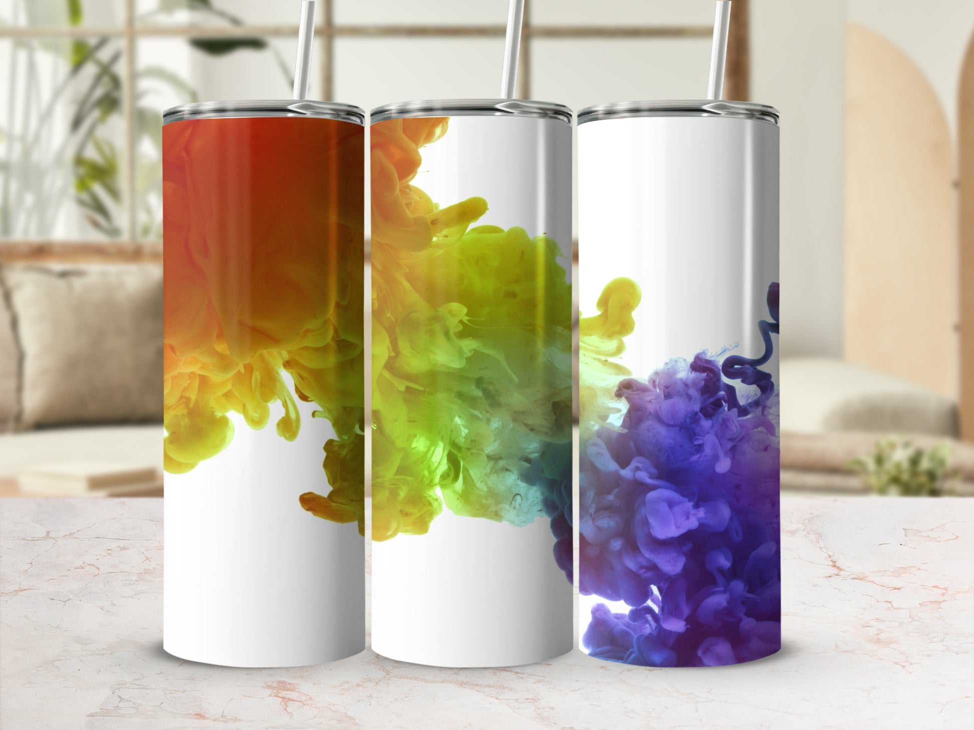 Three tumblers with colorful ink cloud designs in red, green, and purple.