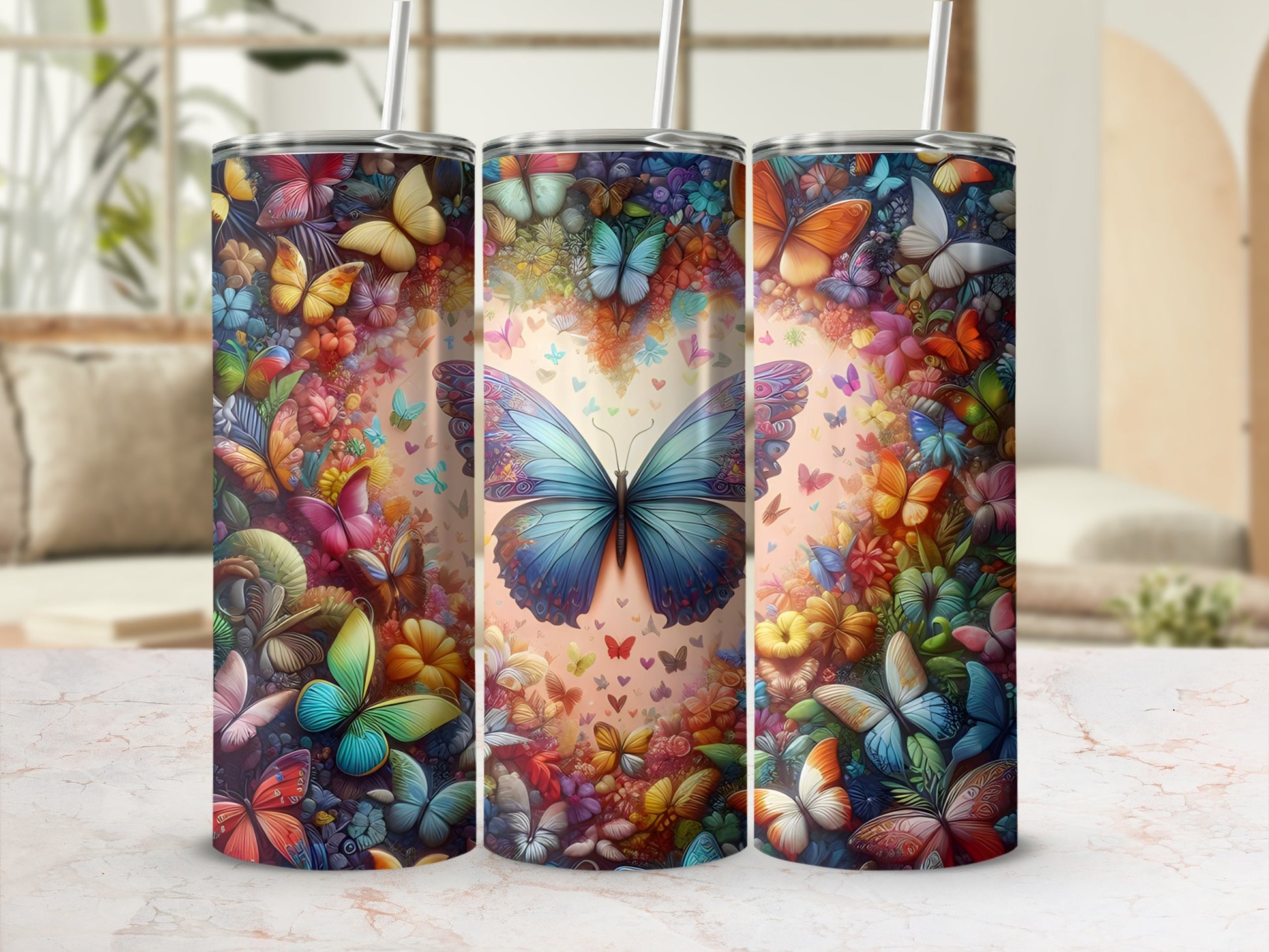 Three tumblers adorned with colorful butterfly and floral patterns.