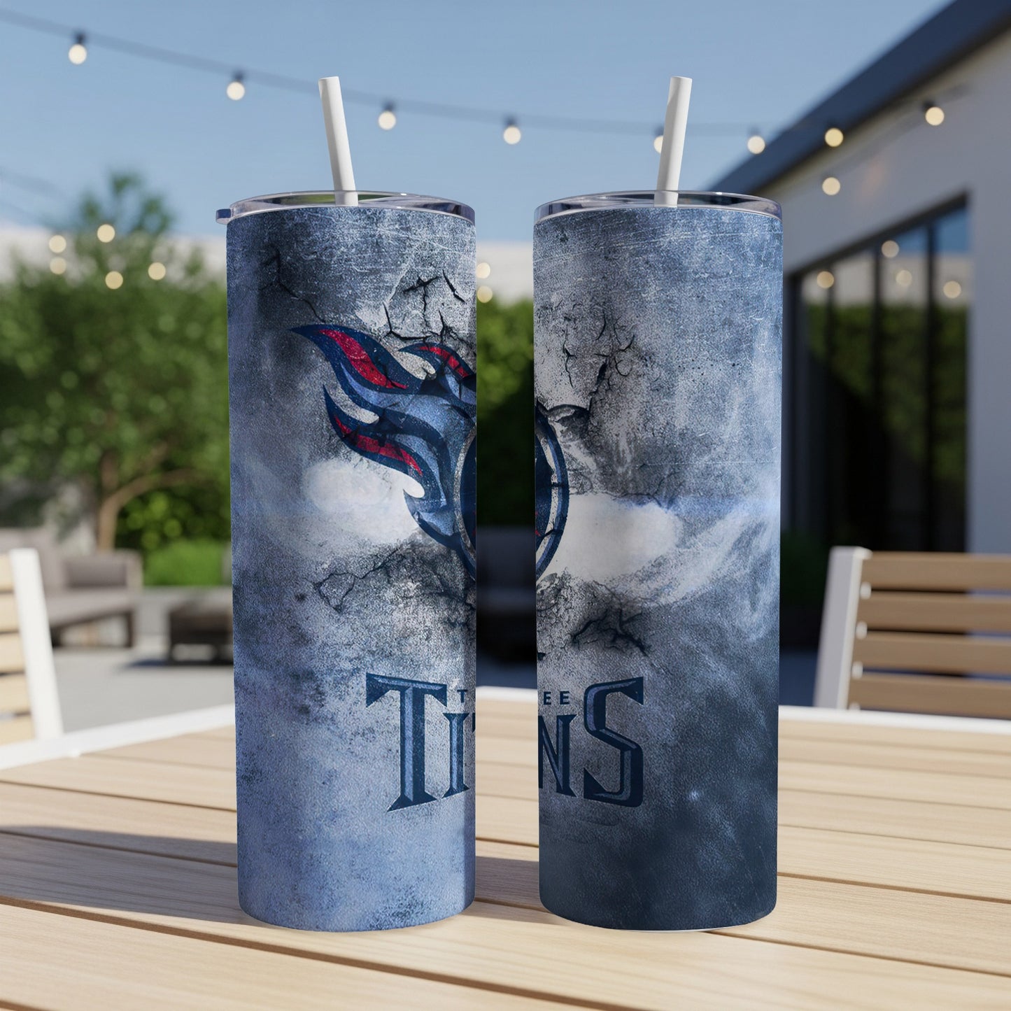 Two tall tumblers with a distressed blue textured design and the Tennessee Titans logo.