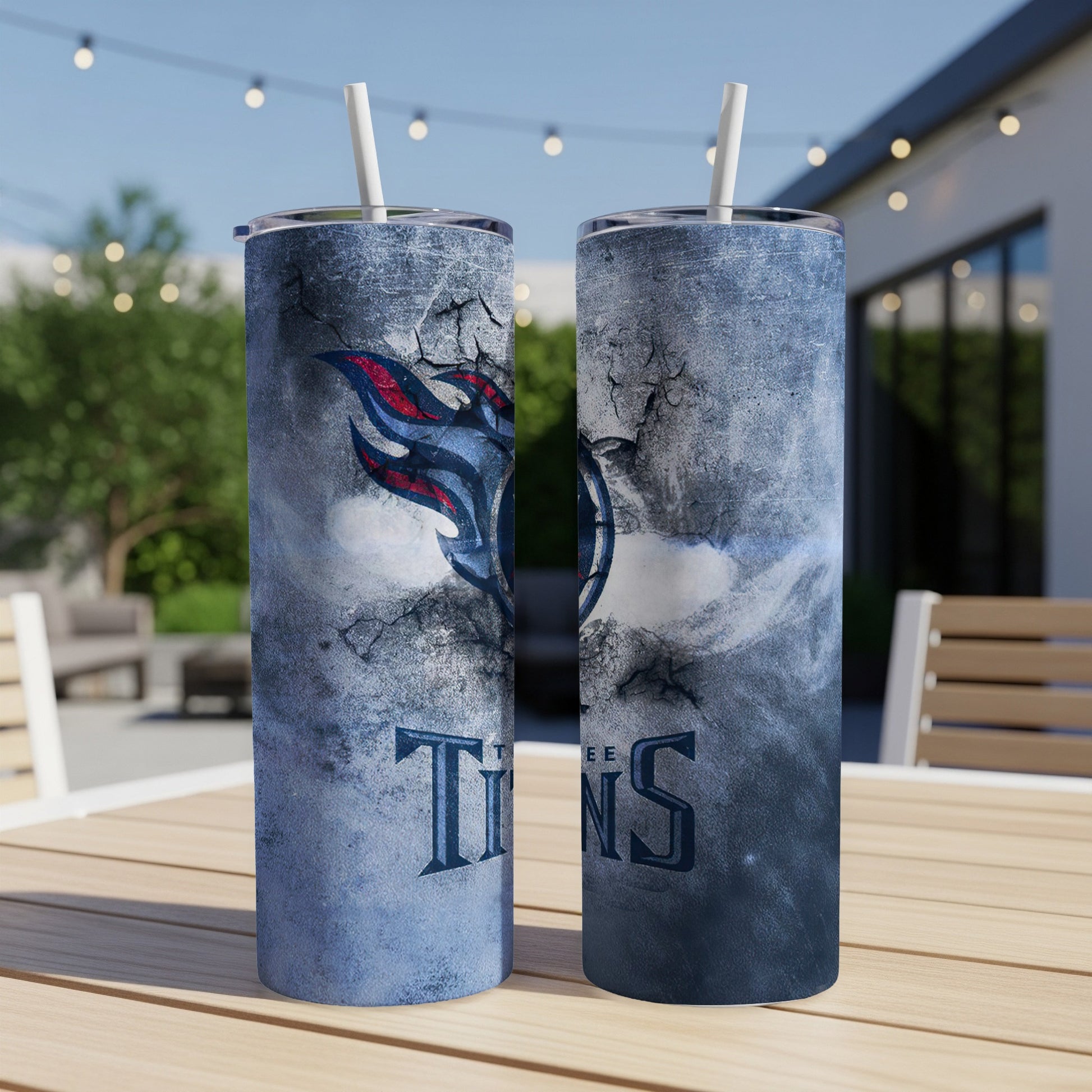 Two tall tumblers with a distressed blue textured design and the Tennessee Titans logo.