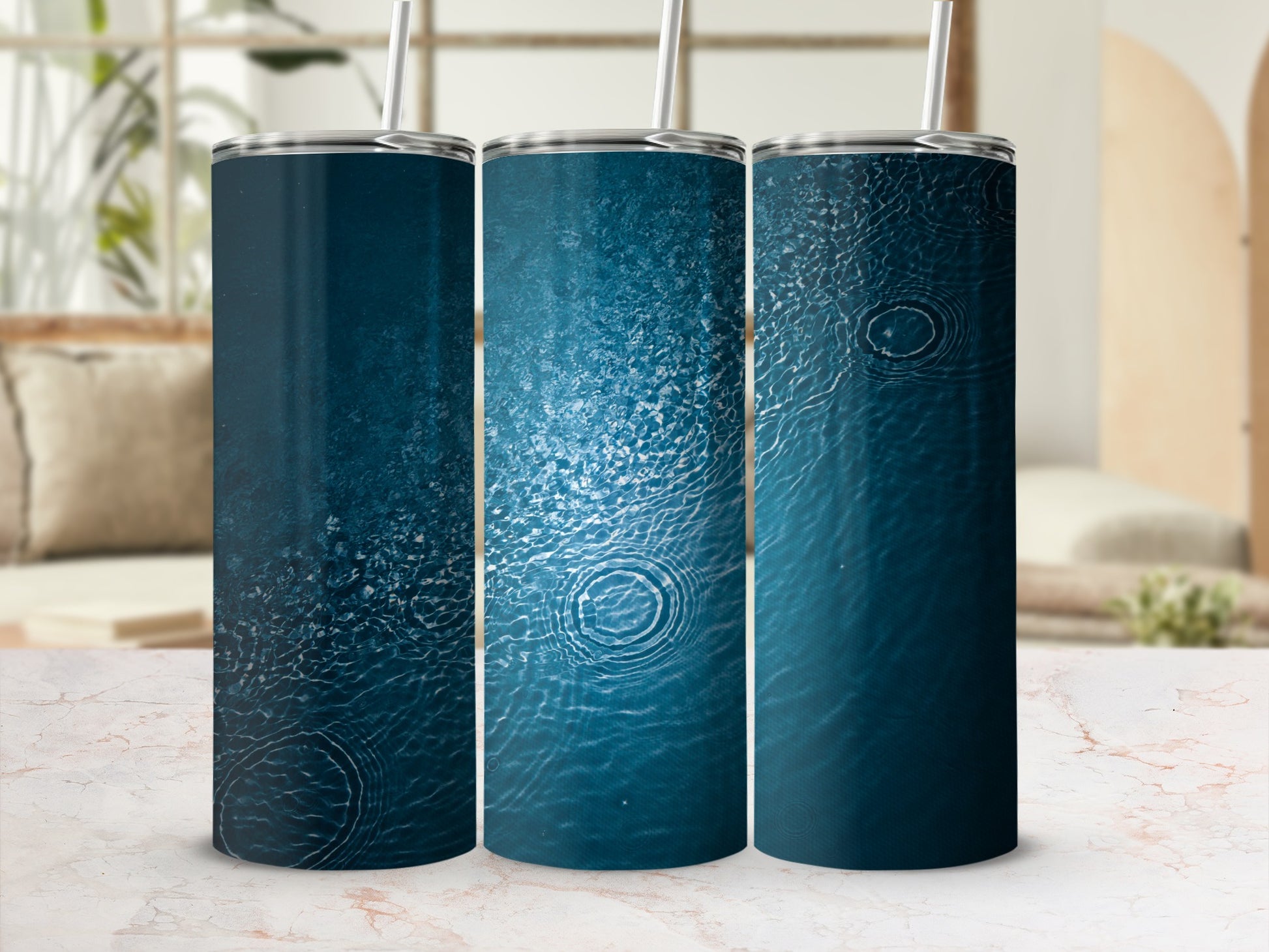 Three tall tumblers with rippling blue water design.