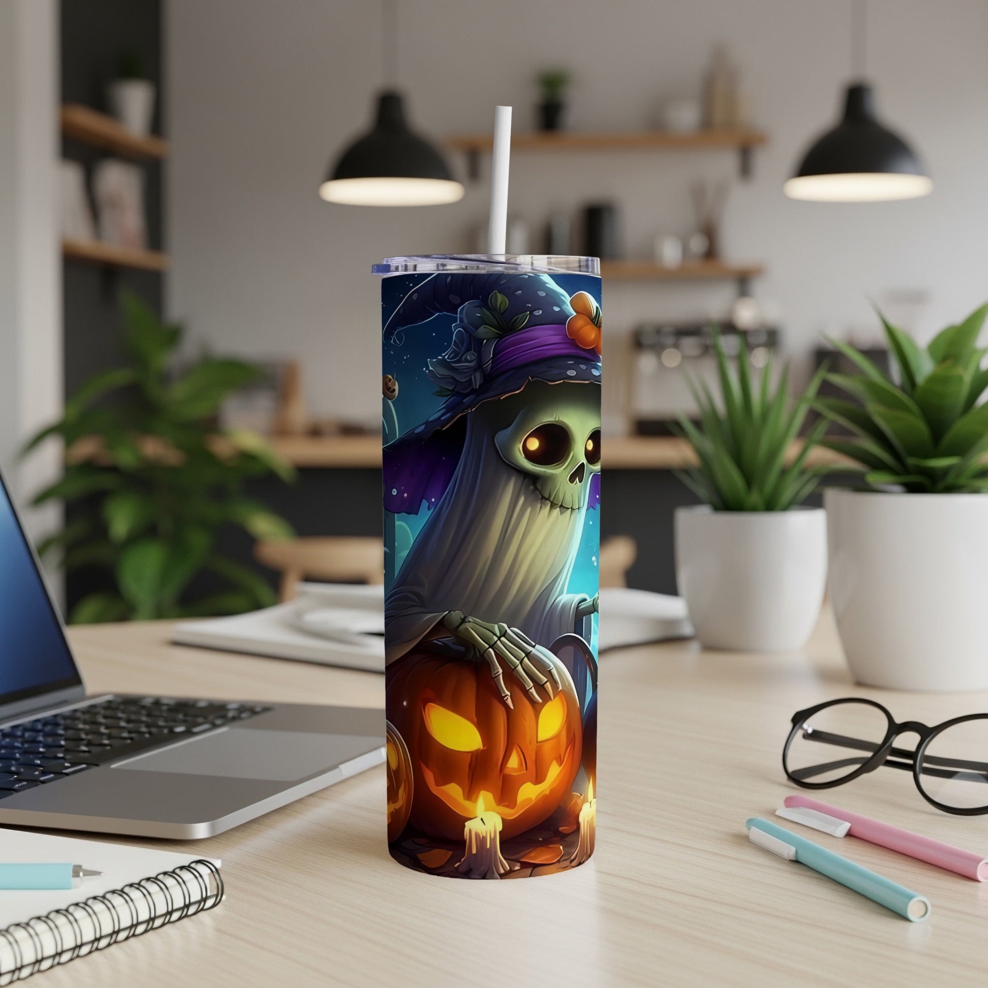 Halloween tumbler with a ghost, witch hat, and jack-o'-lantern design.