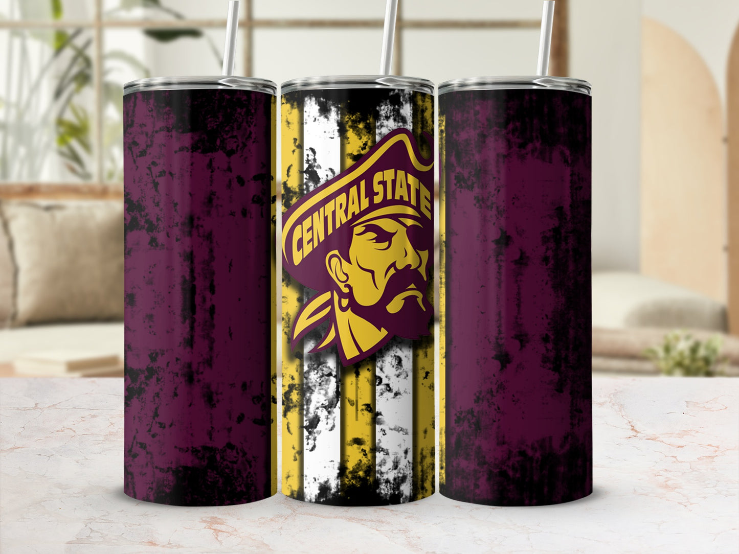 Three tumblers with distressed maroon sides and a central tumbler with pirate logo and Central State text.