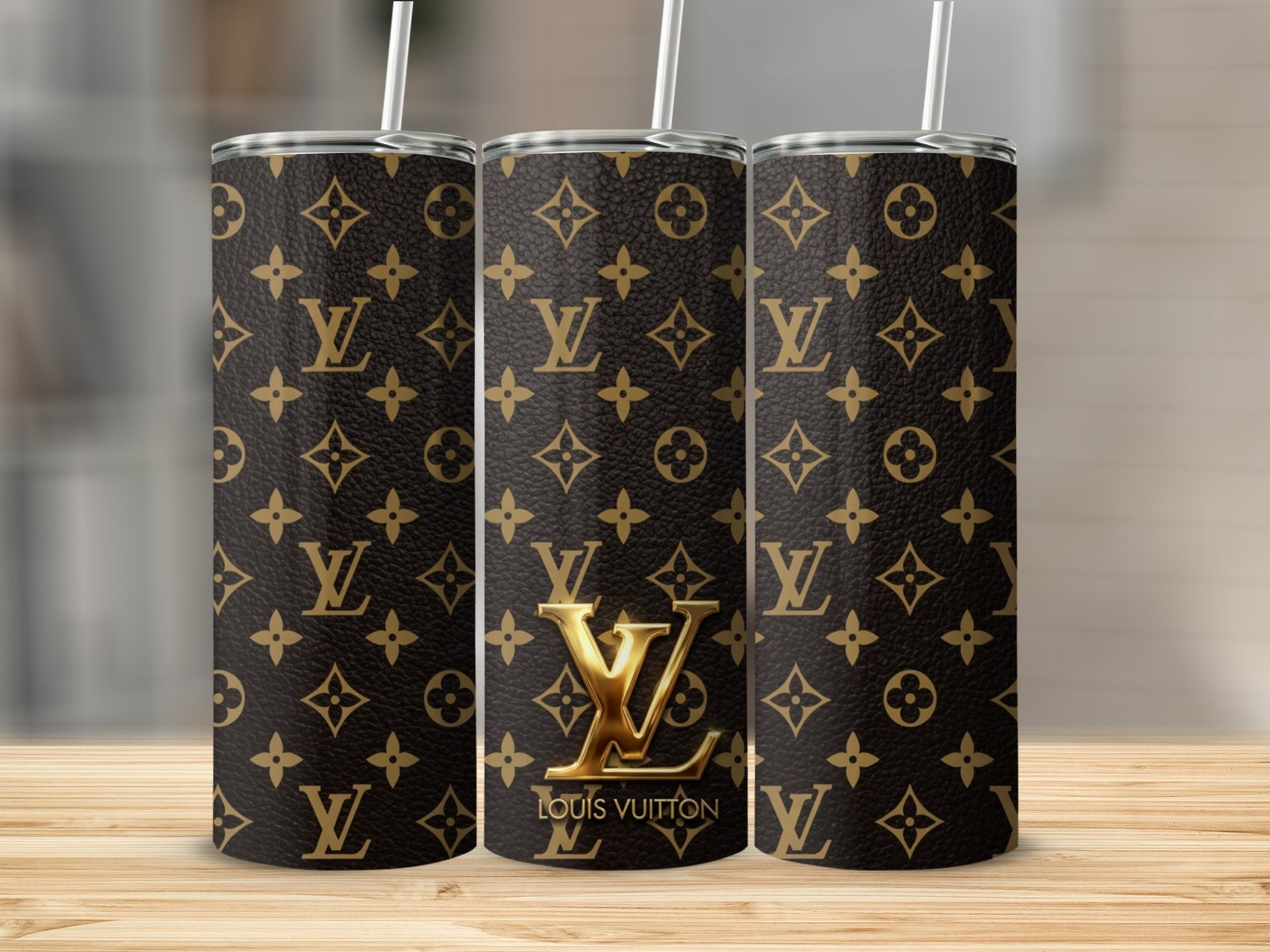 Three tumblers with Louis Vuitton monogram pattern and straws.