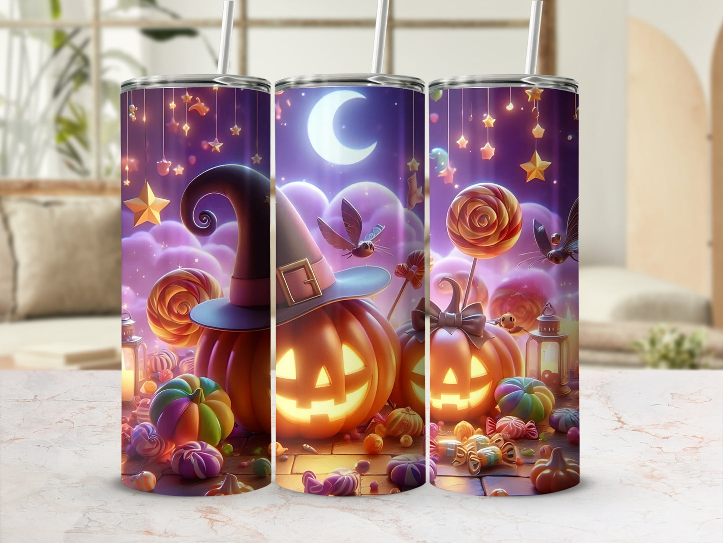 Three tumblers with a Halloween theme featuring jack-o'-lanterns, candy, and stars.