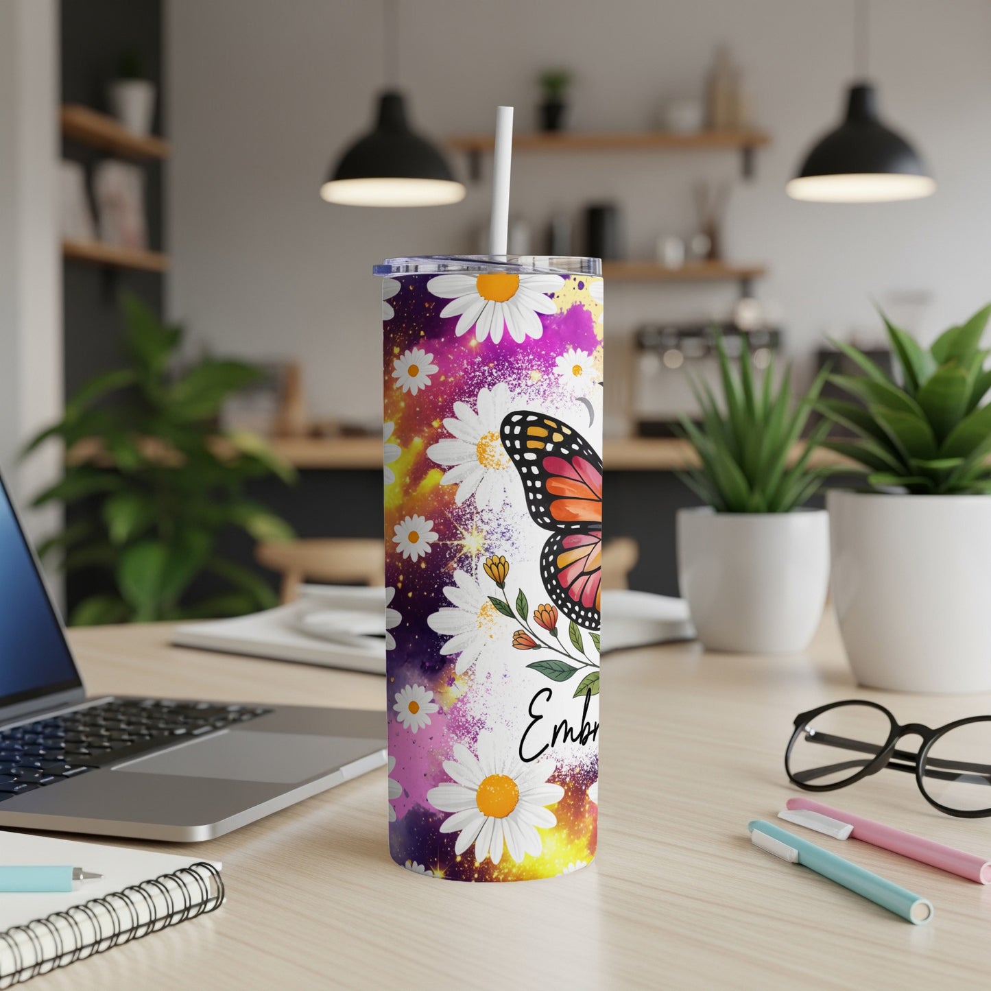 Tumbler with butterfly and daisy design, "Embroidery" text.