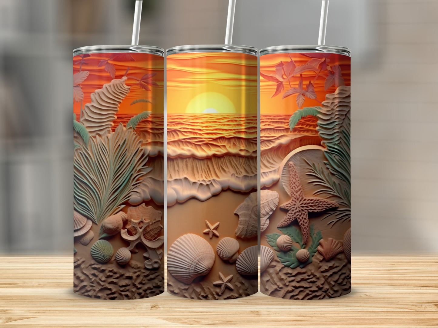 Three tumblers with a tropical sunset beach scene and seashells.