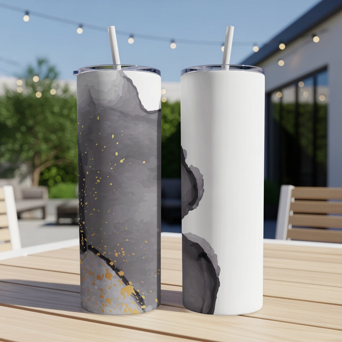Two tall tumblers, one black and gold abstract, one white with abstract gray.