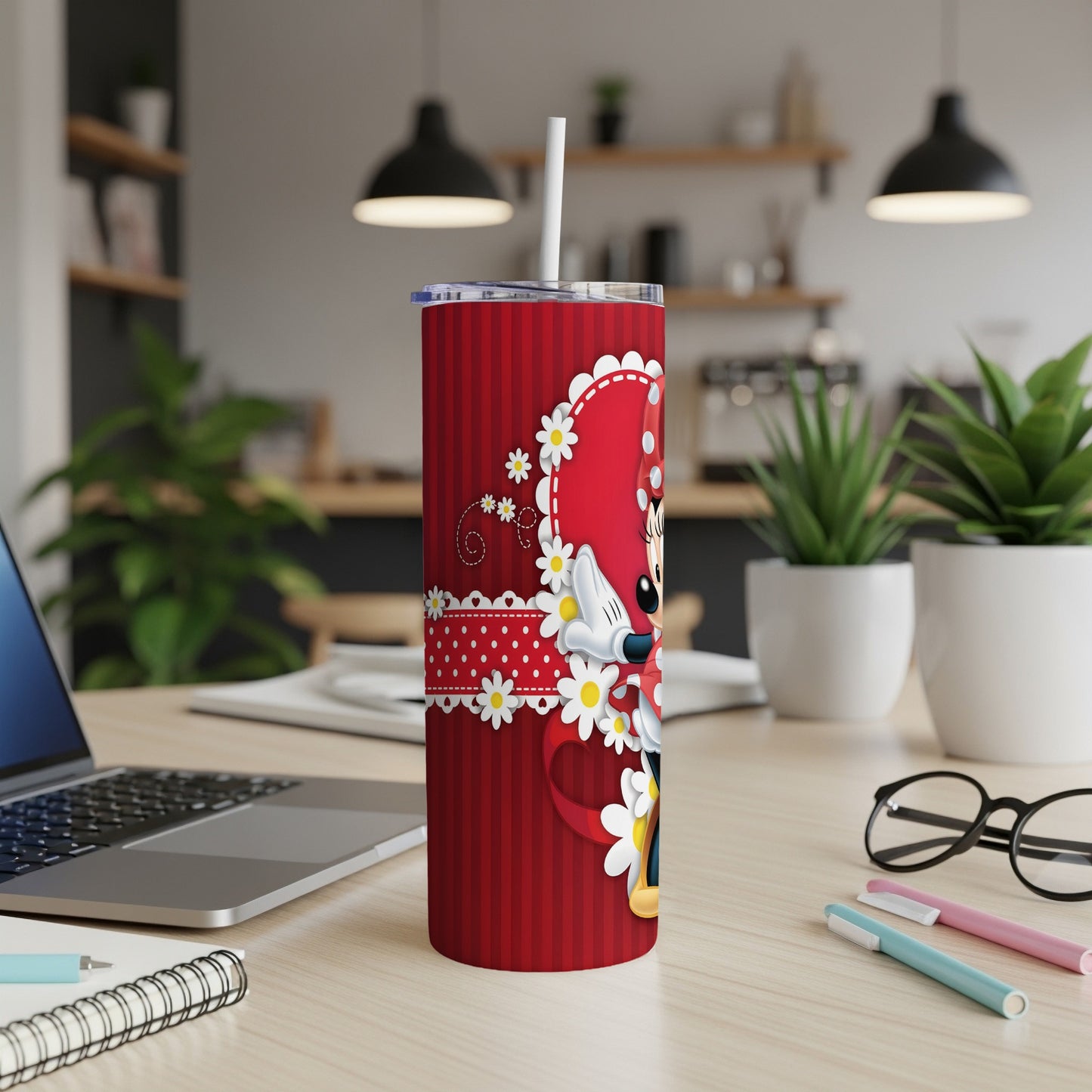 Red tumbler with Minnie Mouse design, white straw, and white daisies.