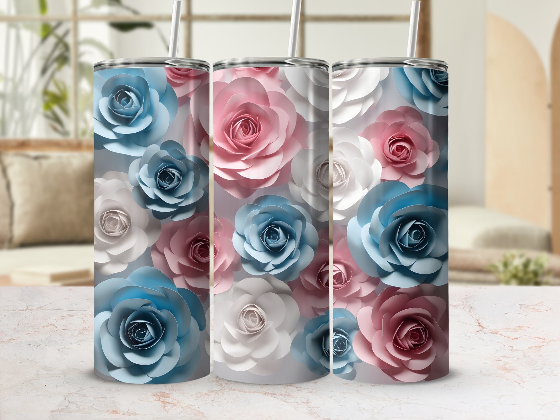 Three tumblers with layered paper rose floral designs in pink, blue, and white.
