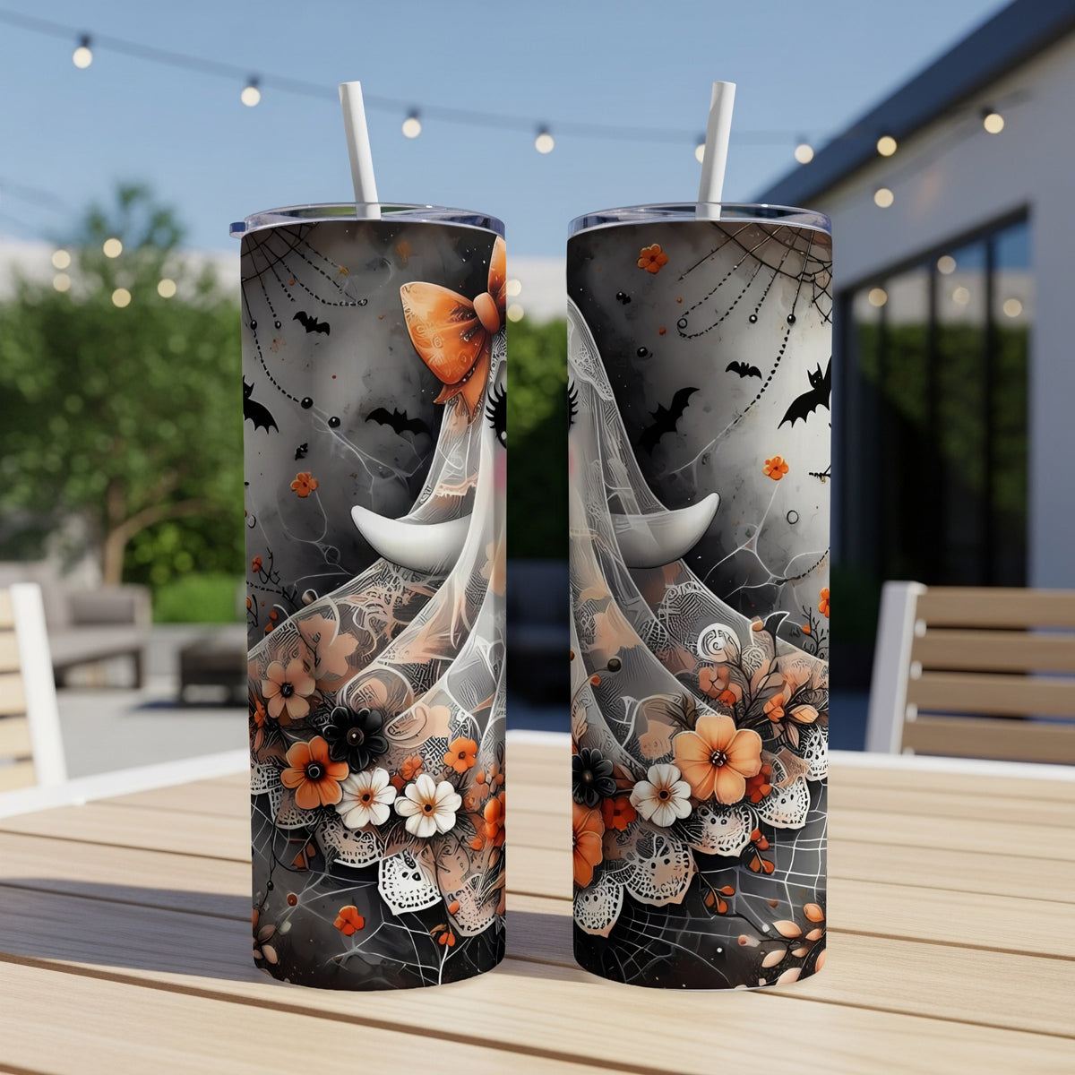 Two tumblers with Halloween-themed lace, bats, and floral designs.