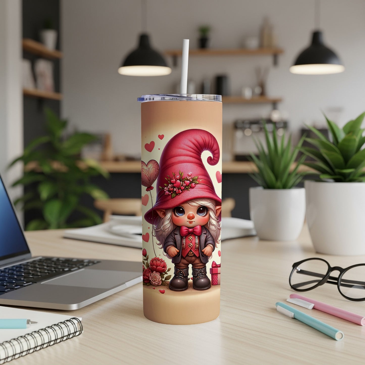 Gnome tumbler with hearts and floral accents, placed on a desk.