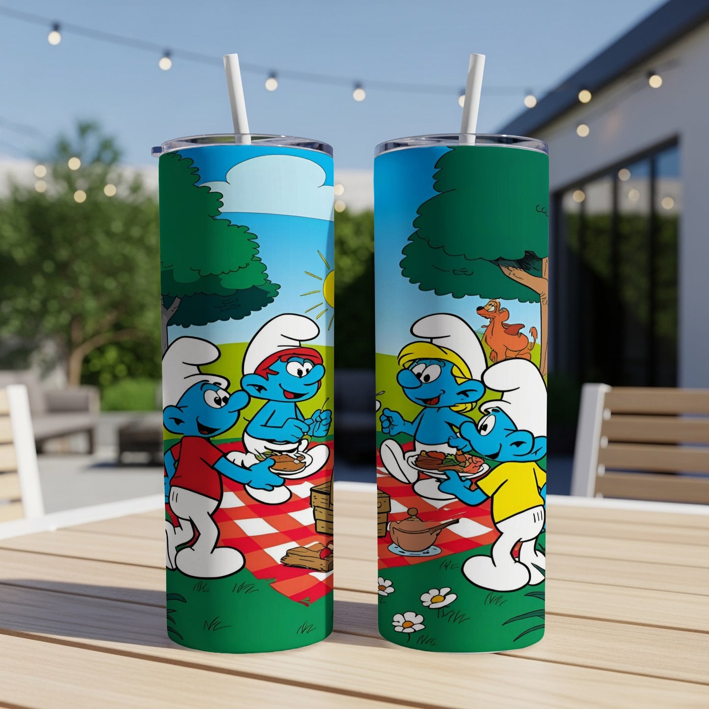 Smurfs having a picnic outdoors with food and drinks.
