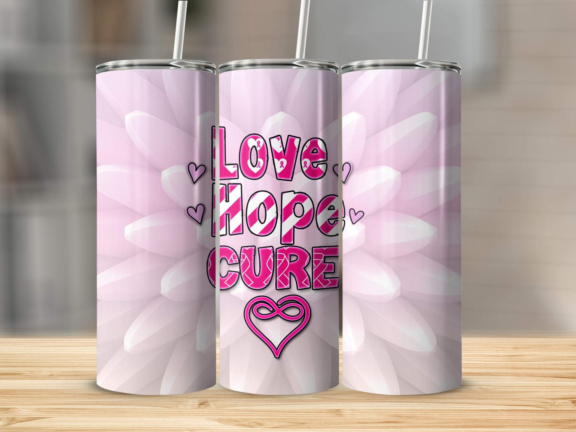 Pink floral tumbler with "Love Hope Cure" text and heart ribbon.