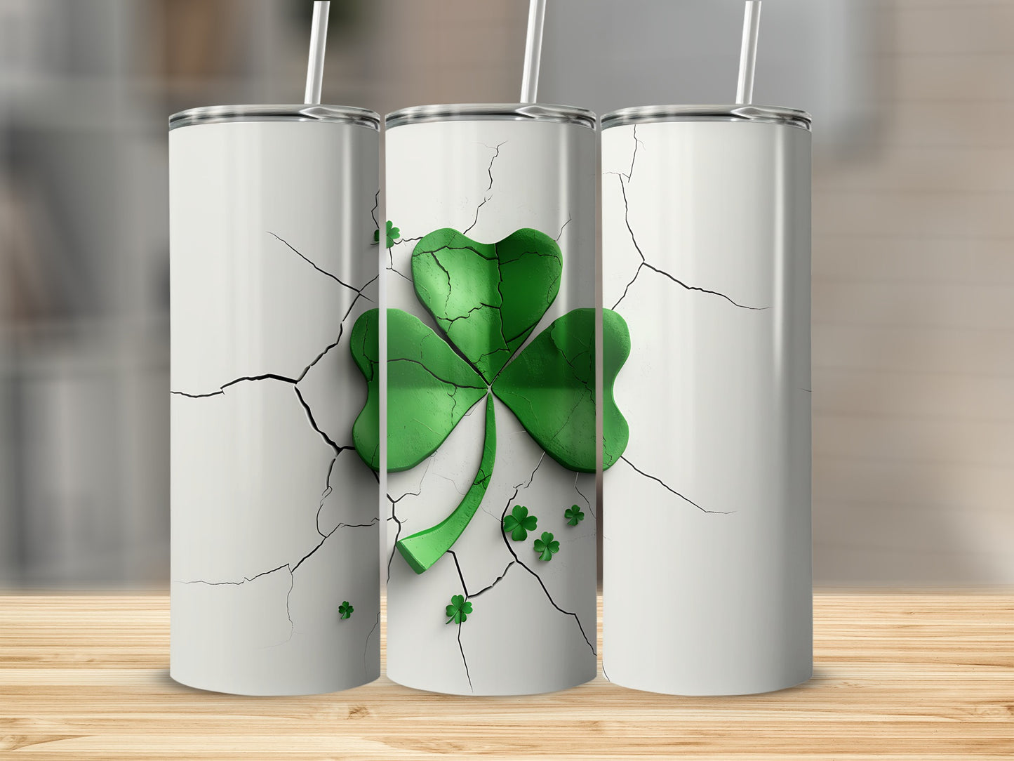 Three white tumblers with a cracked design and green shamrock decoration.