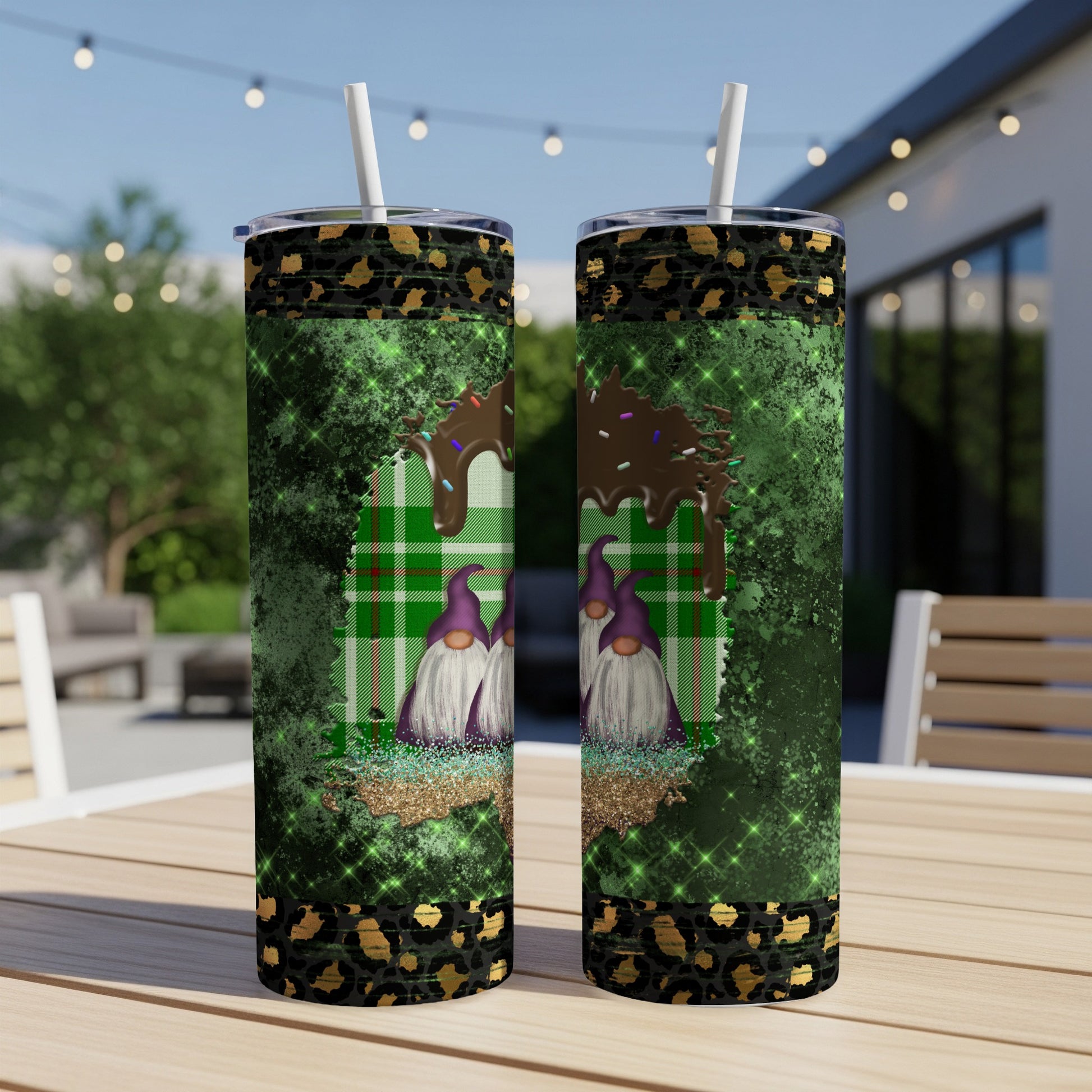 Two tumblers with purple gnomes, green plaid, and chocolate drip.
