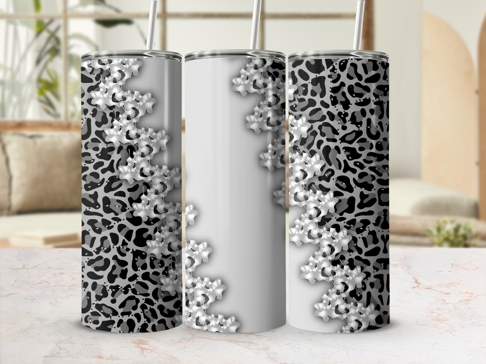 Three tumblers with leopard print and floral design.