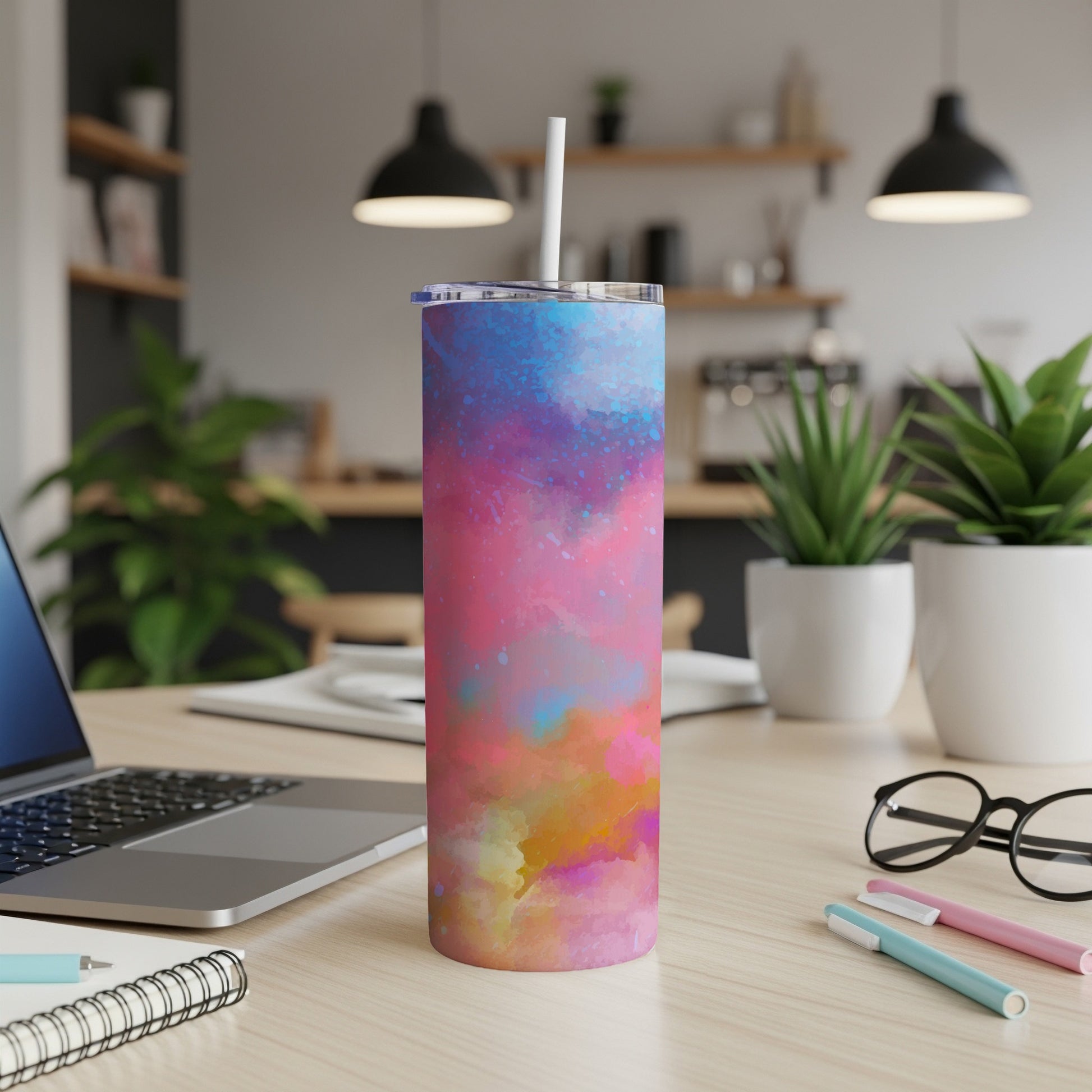 Tumbler with a colorful tie-dye pattern of pink, blue, and yellow.