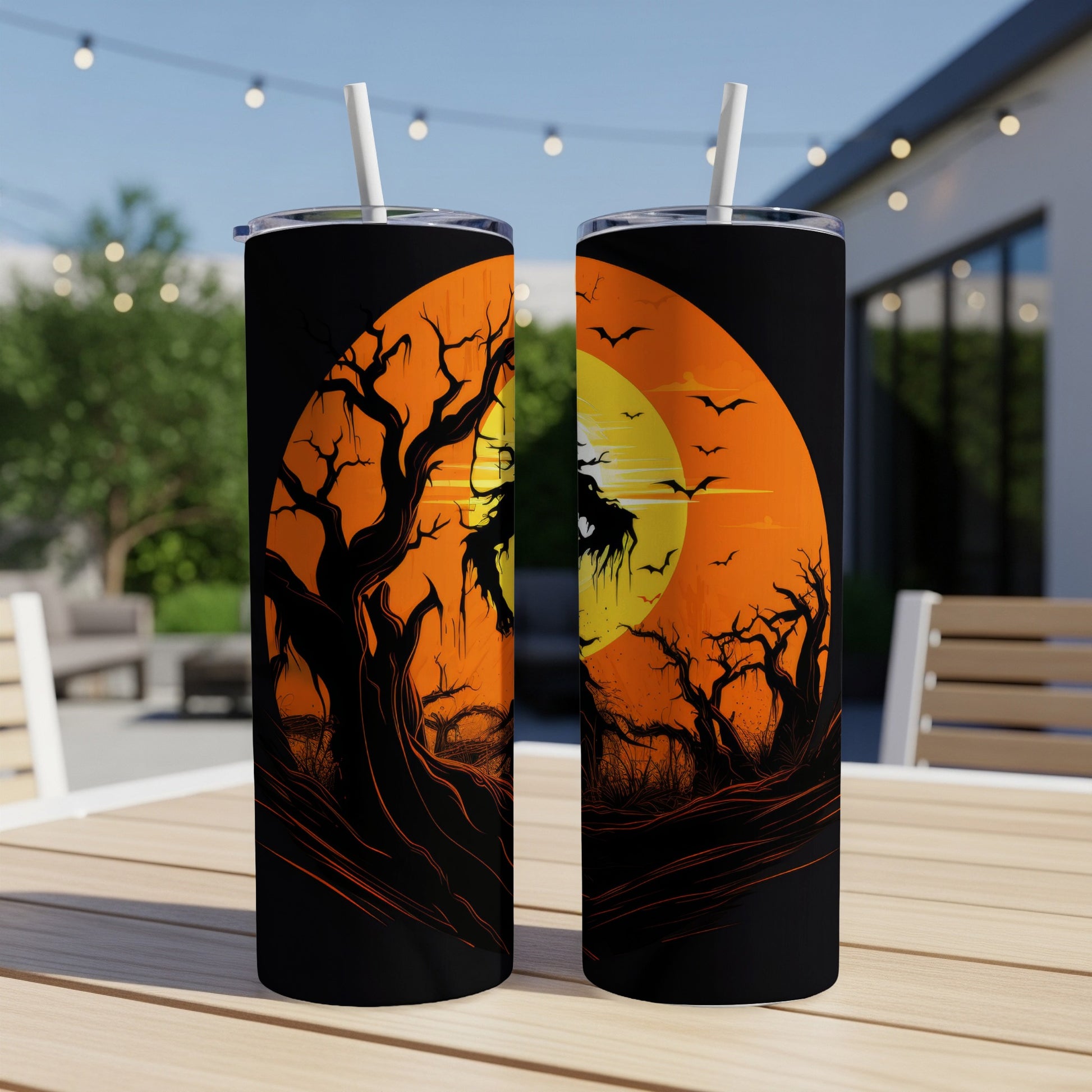 Two tumblers featuring a spooky Halloween scene with bats and gnarled trees under an orange moon.