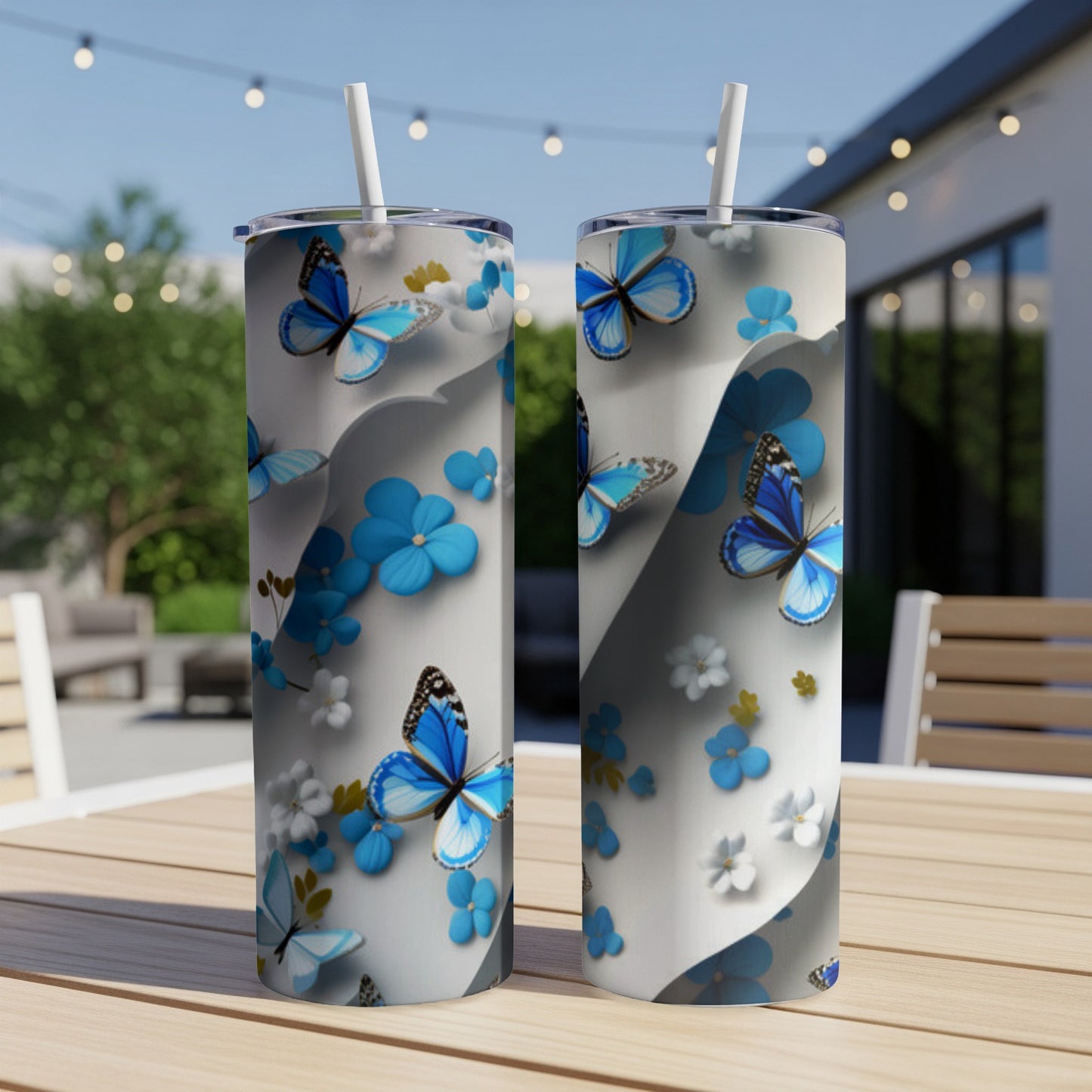 Two white tumblers with blue butterfly and floral design.
