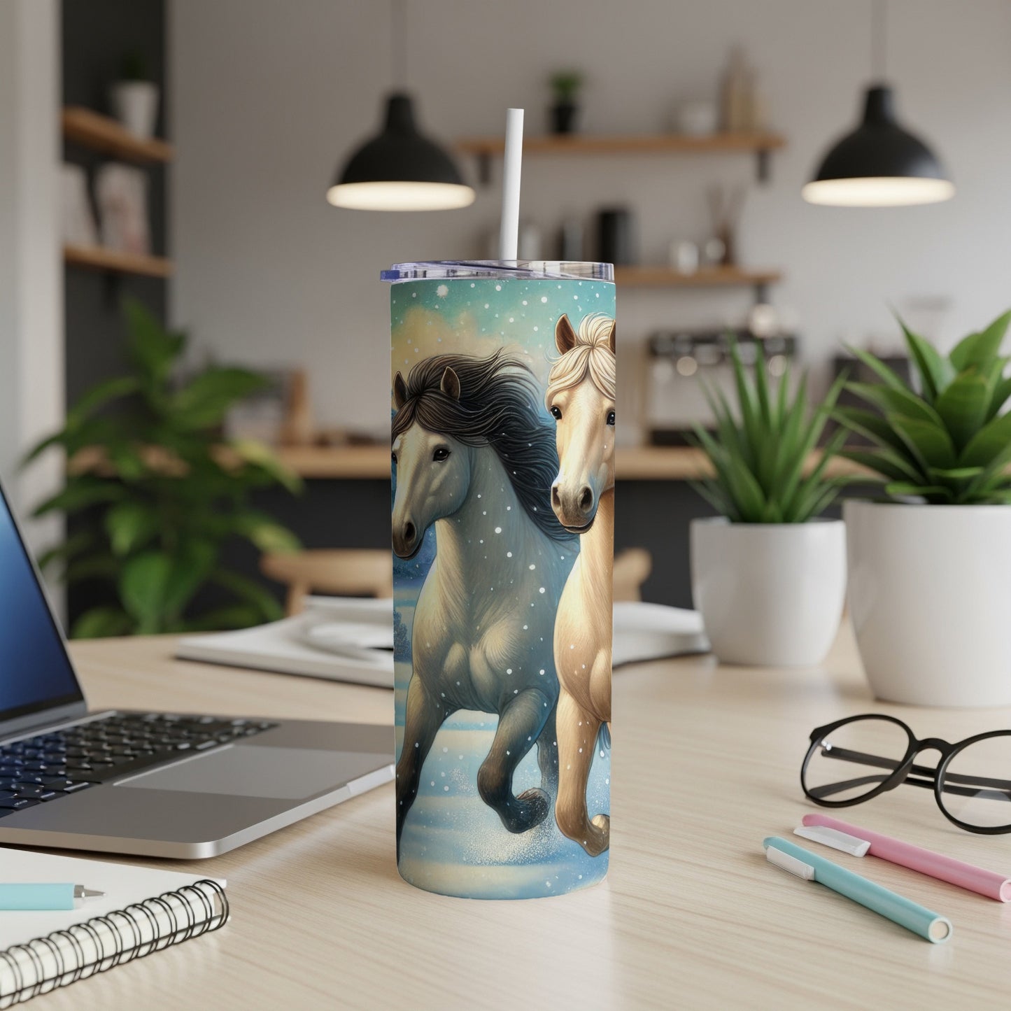 Two horses galloping in a snowy landscape on a tumbler.