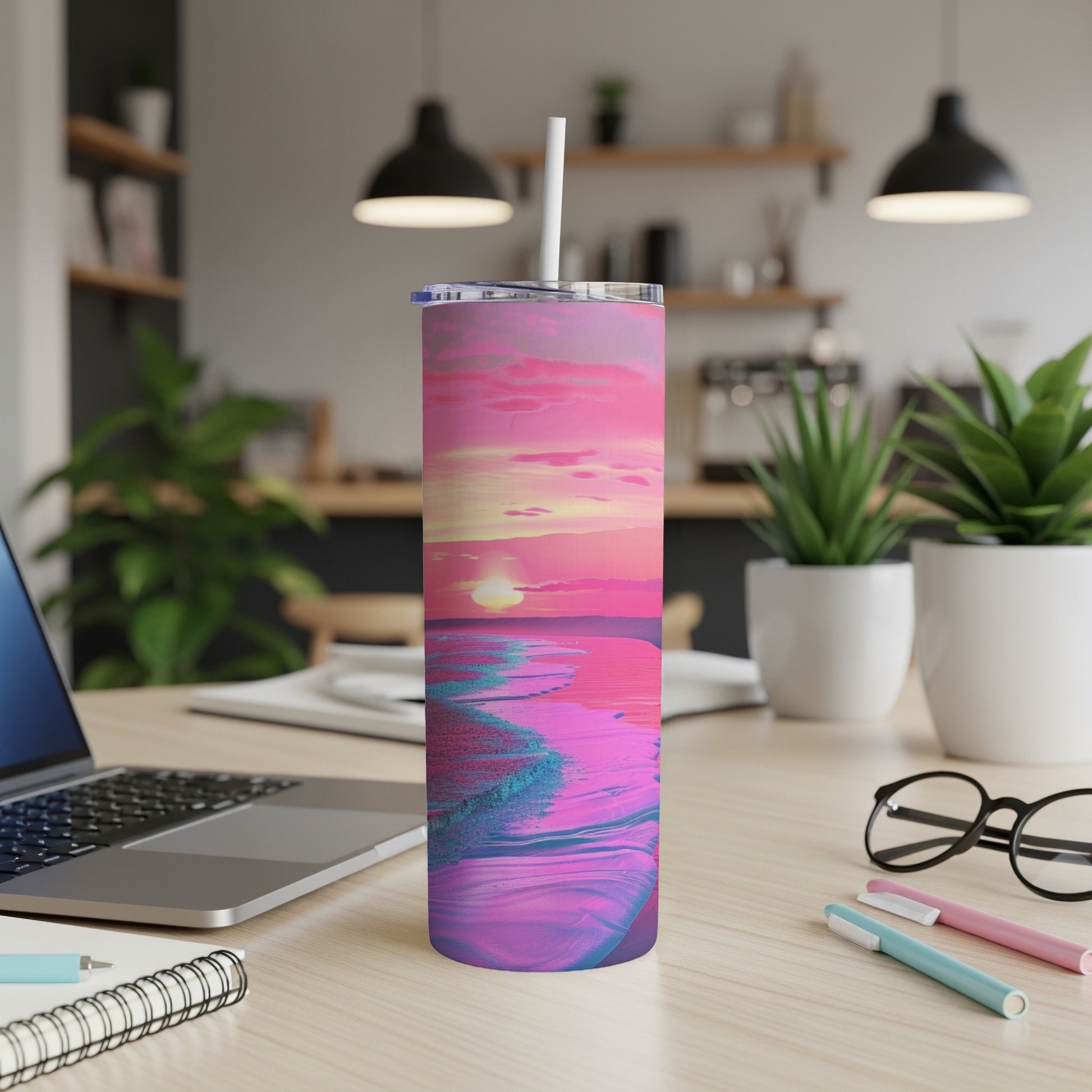 Pink and blue abstract sunset beach scene on a skinny tumbler with straw.