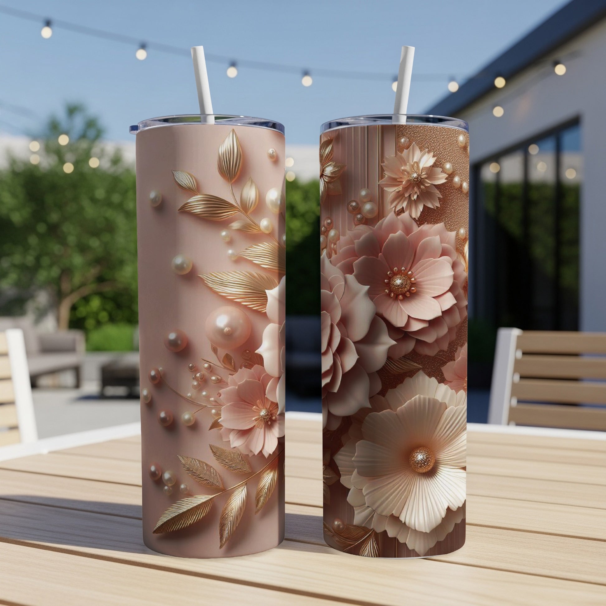 Two tall tumblers with floral and pearl embellishments on a wooden table.