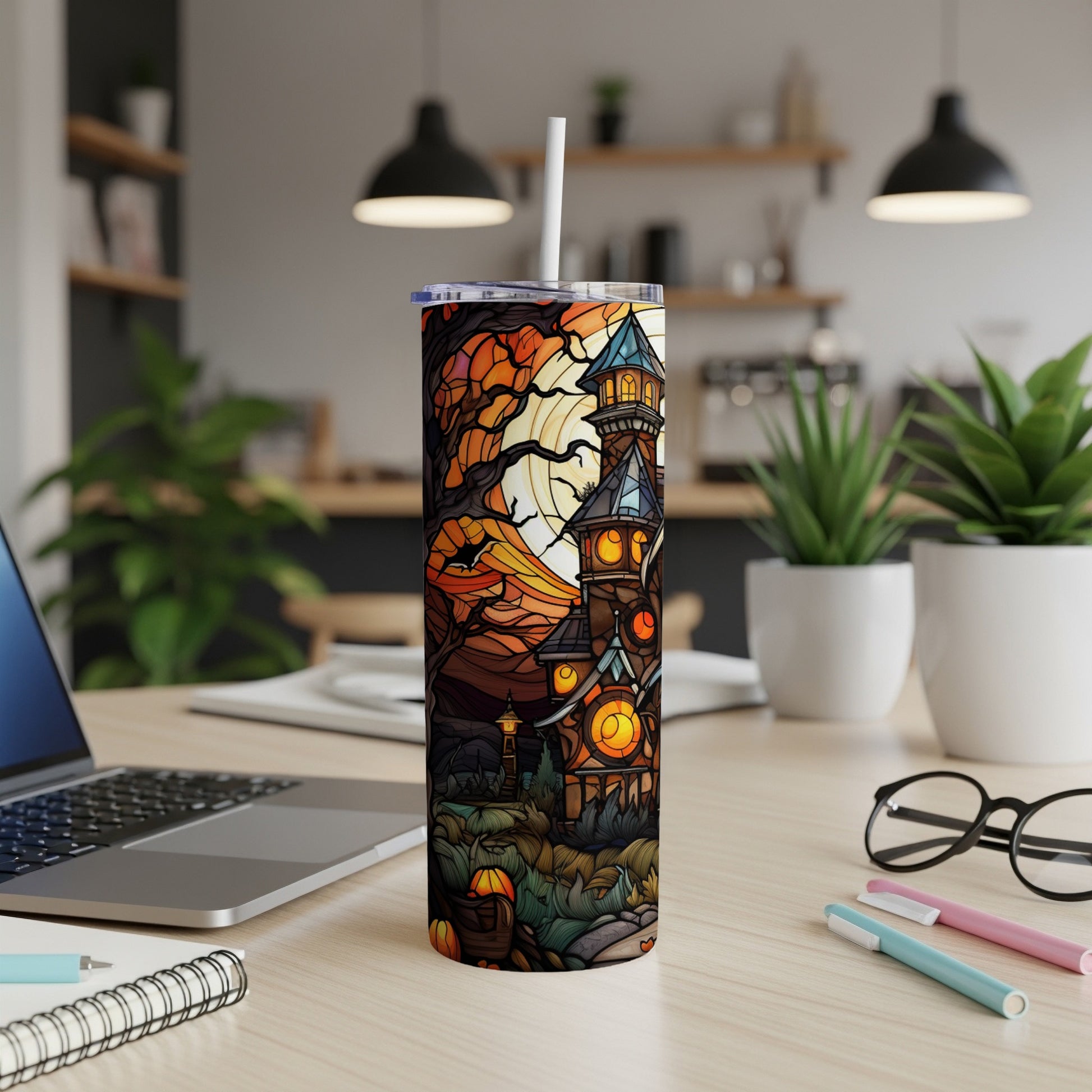 Spooky haunted house tumbler with Halloween pumpkins and fall leaves.