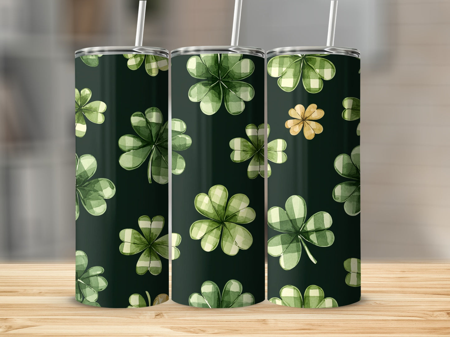 Green plaid shamrocks on dark background, two tumblers visible.