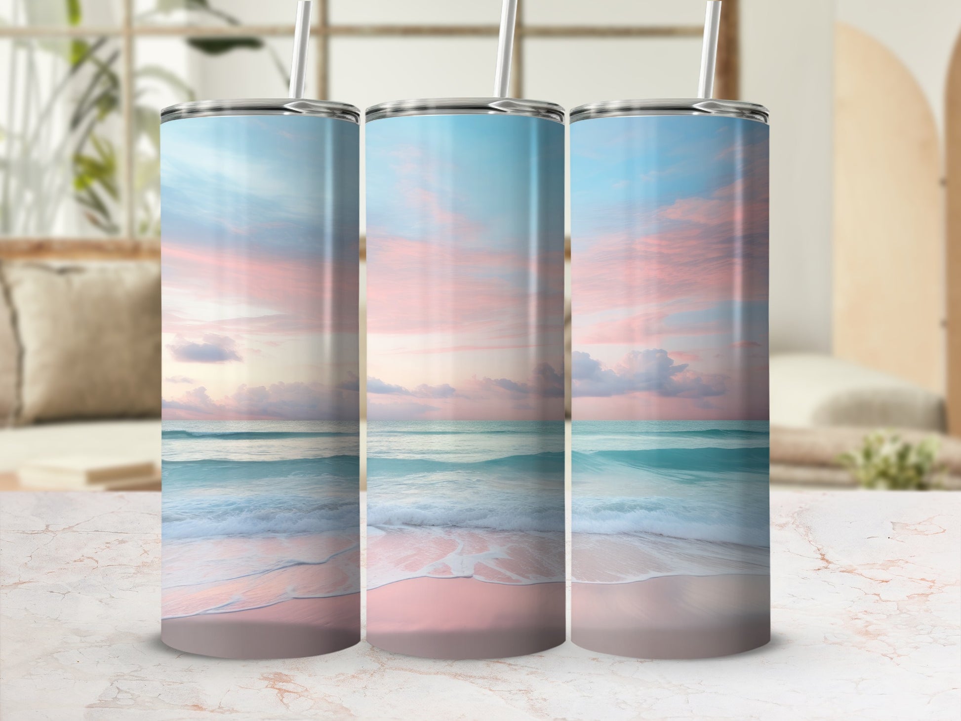 Three tumblers featuring a pastel beach sunset with waves on sand.