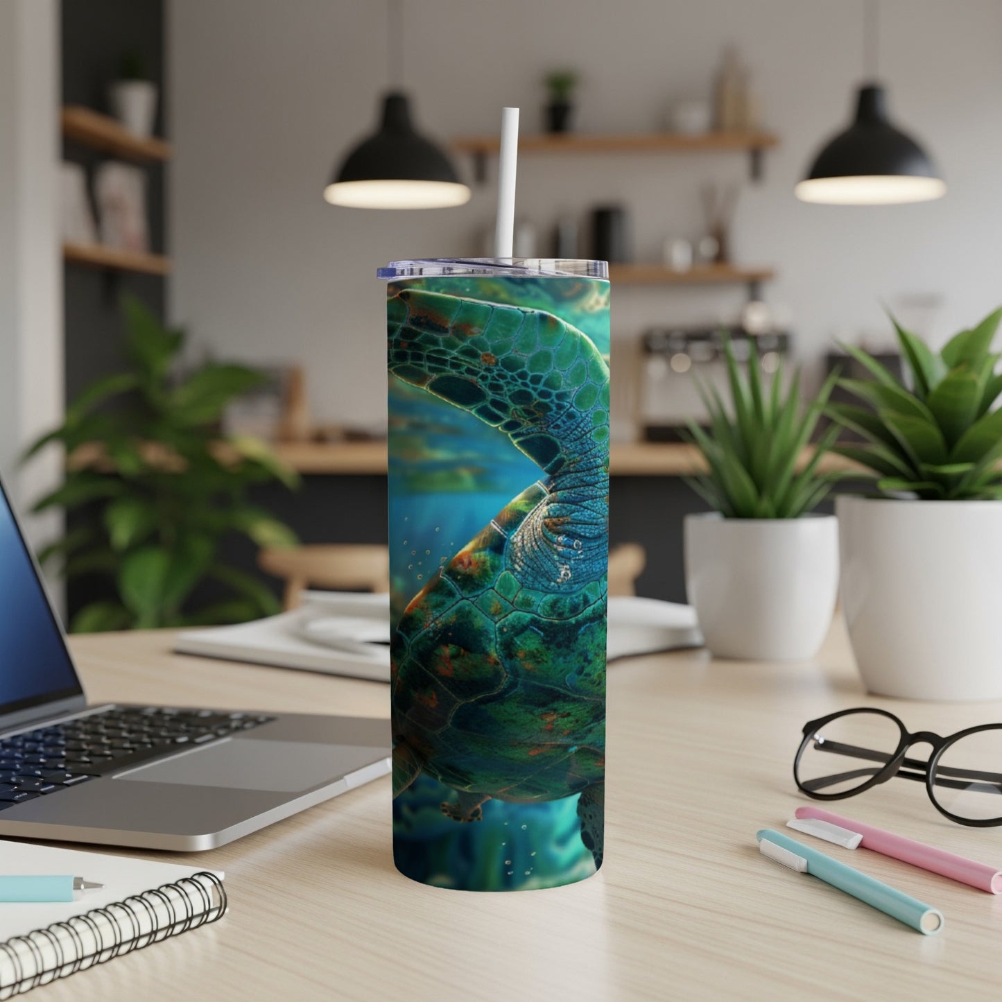 Green sea turtle swimming underwater on a patterned tumbler.